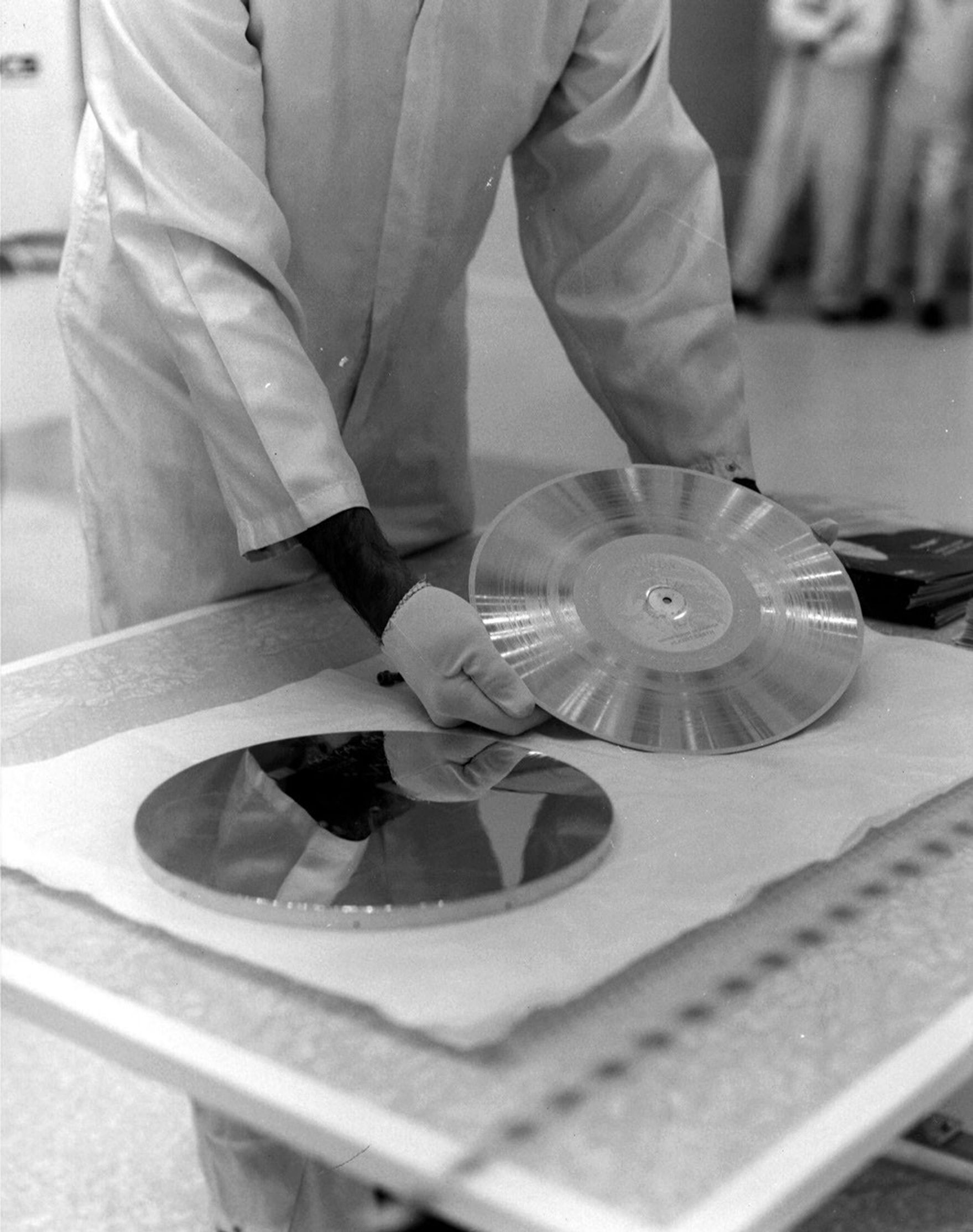 NASA's Voyager 1 Golden Record is prepared for installation on the spacecraft in this archival image from 1977.