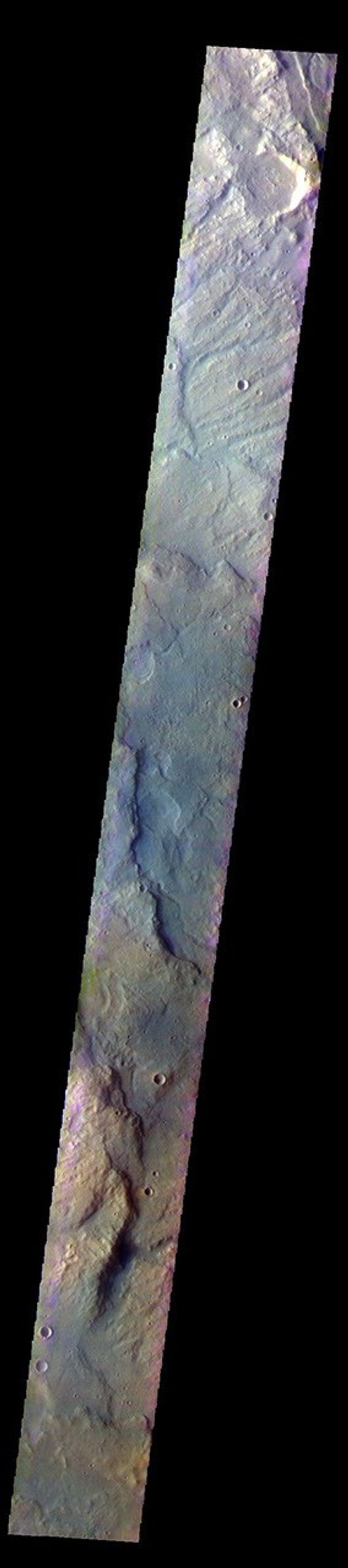 The THEMIS camera contains 5 filters. The data from different filters can be combined in multiple ways to create a false color image. This image from NASA's 2001 Mars Odyssey spacecraft shows part of the plains and highlands of Terra Sirenum.