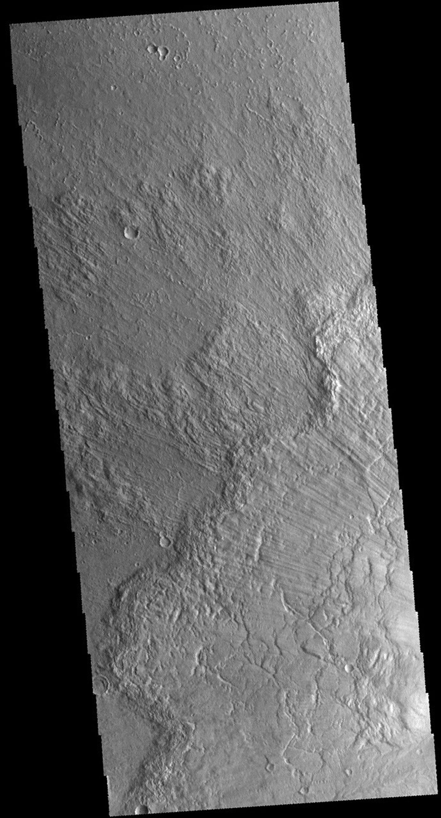 This image captured by NASA's 2001 Mars Odyssey spacecraft shows some of the ejecta from Bacolor Crater in Utopia Planitia.