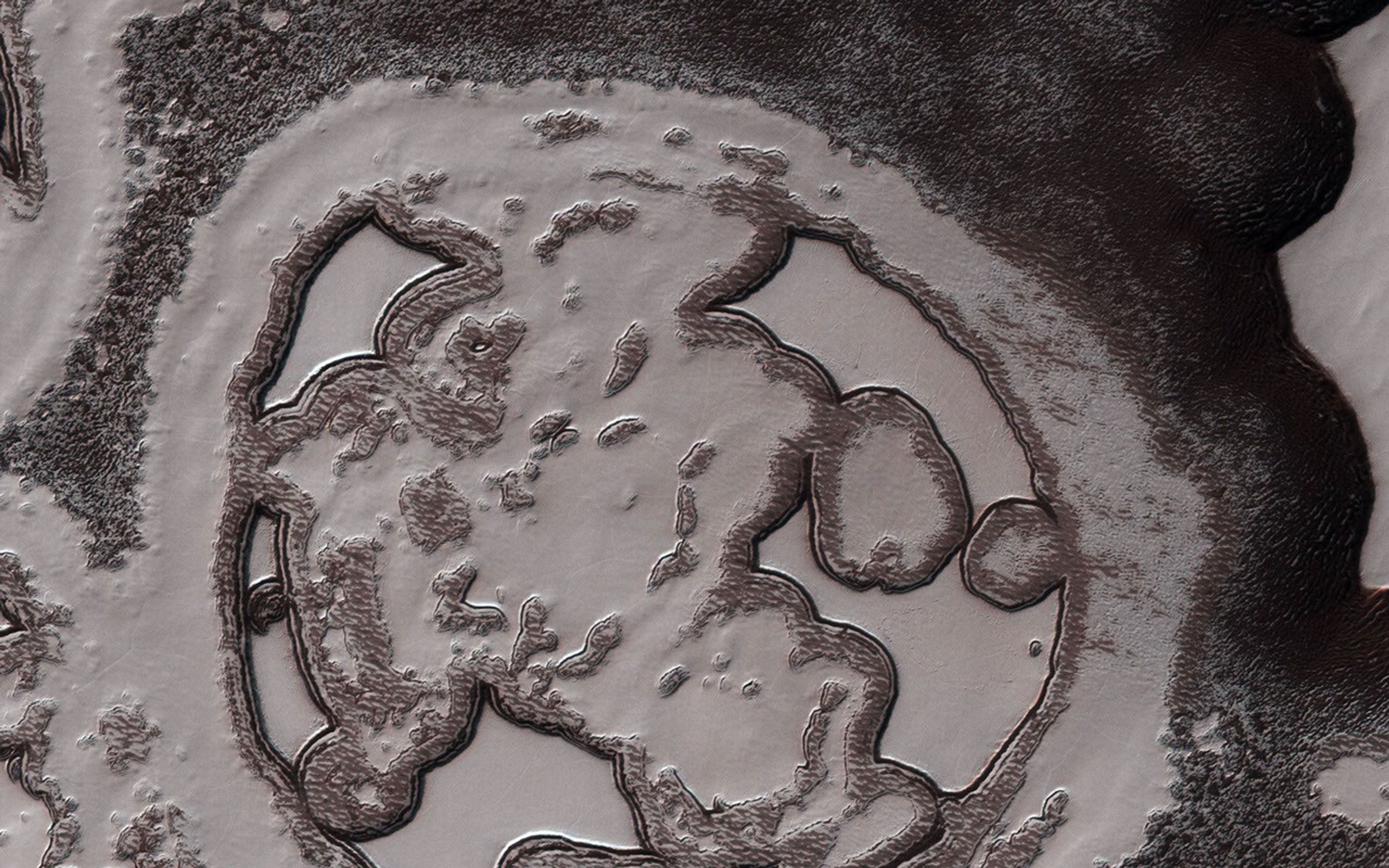 This image from NASA's Mars Reconnaissance Orbiter shows one of Mars' South Polar residual cap where ice remains even after the peak of summer arrives.