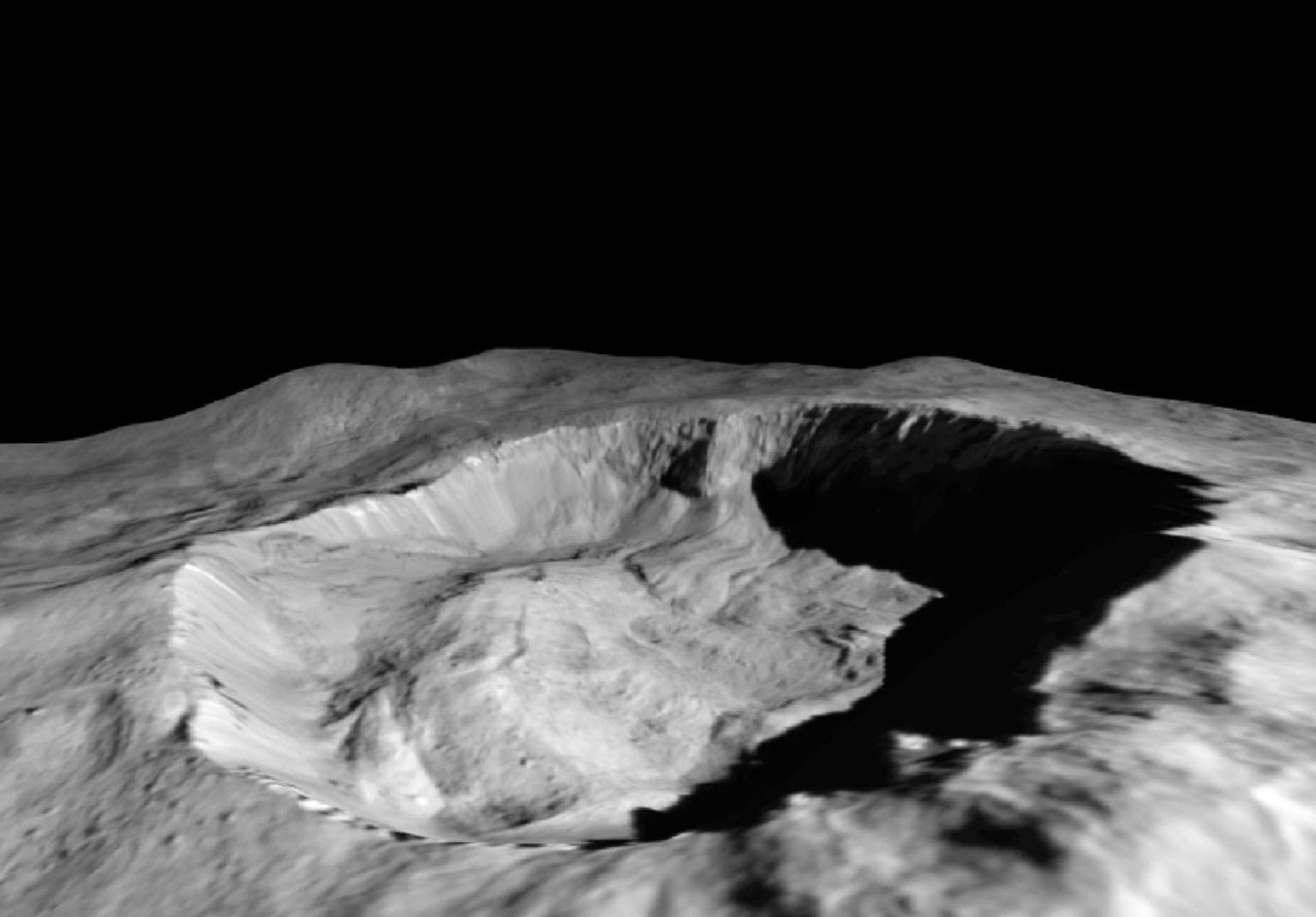 This view from NASA's Dawn mission shows where ice has been detected in the northern wall of Ceres' Juling Crater, which is in almost permanent shadow.