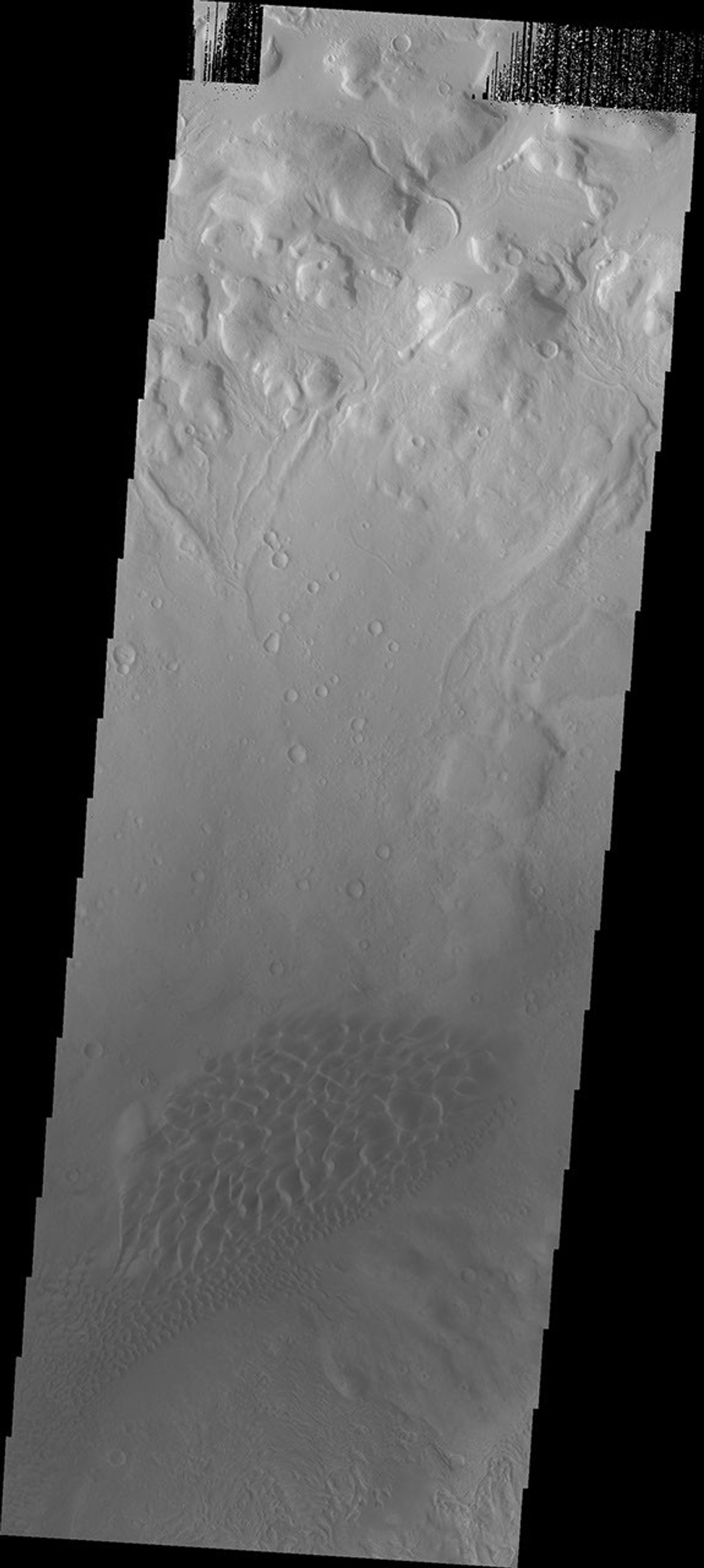Moreux Crater is located in northern Arabia Terra. The crater contains a central peak, and dunes on the floor of the crater. This image from NASA's 2001 Mars Odyssey spacecraft shows the dune field to the northwest of the central peak.