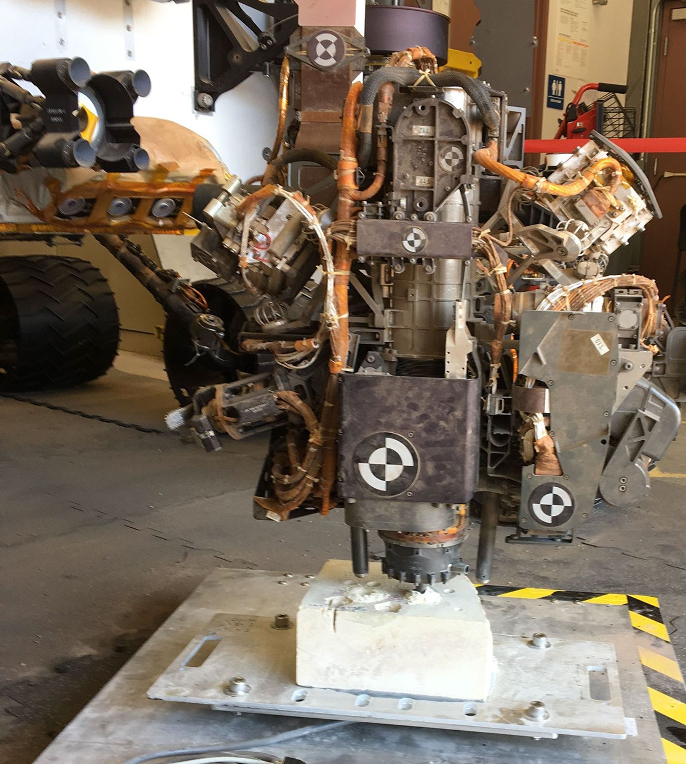 This photo taken in the Mars Yard at NASA's JPL, Pasadena, California, on Aug. 1, 2017, shows a step in development of possible alternative techniques that NASA's Curiosity Mars rover might be able to use to resume drilling into rocks on Mars.