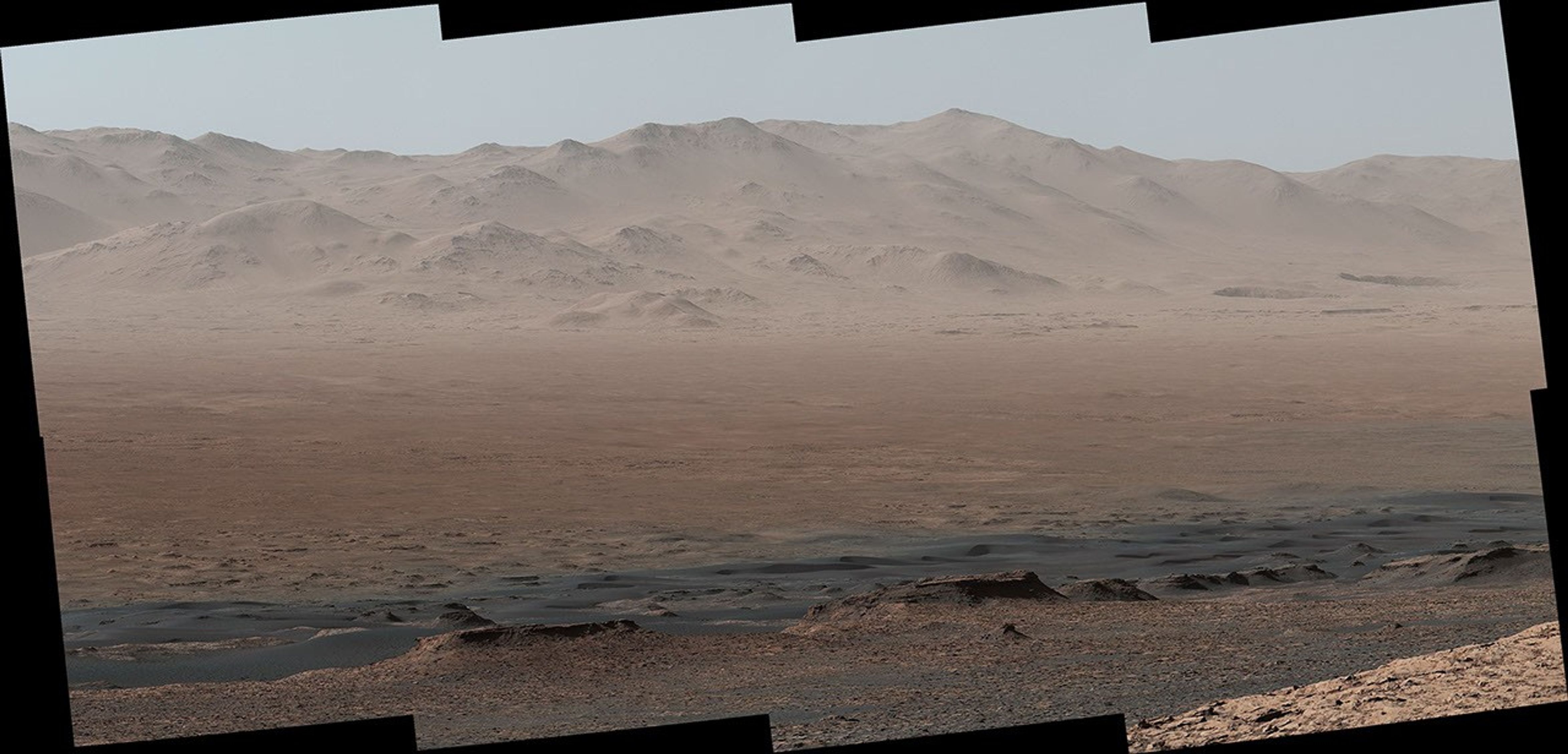 A vantage point on 'Vera Rubin Ridge' provided NASA's Curiosity Mars rover this detailed look back over the area where it began its mission inside Gale Crater, plus more-distant features of the crater.
