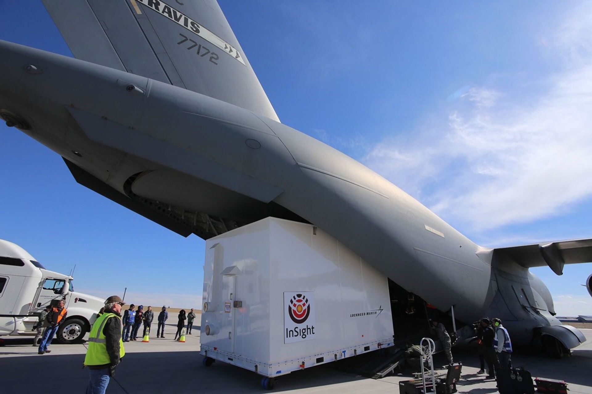 Personnel supporting NASA's InSight mission to Mars load the crated InSight spacecraft into a C-17 cargo aircraft at Buckley Air Force Base, Denver, for shipment to Vandenberg Air Force Base, California.