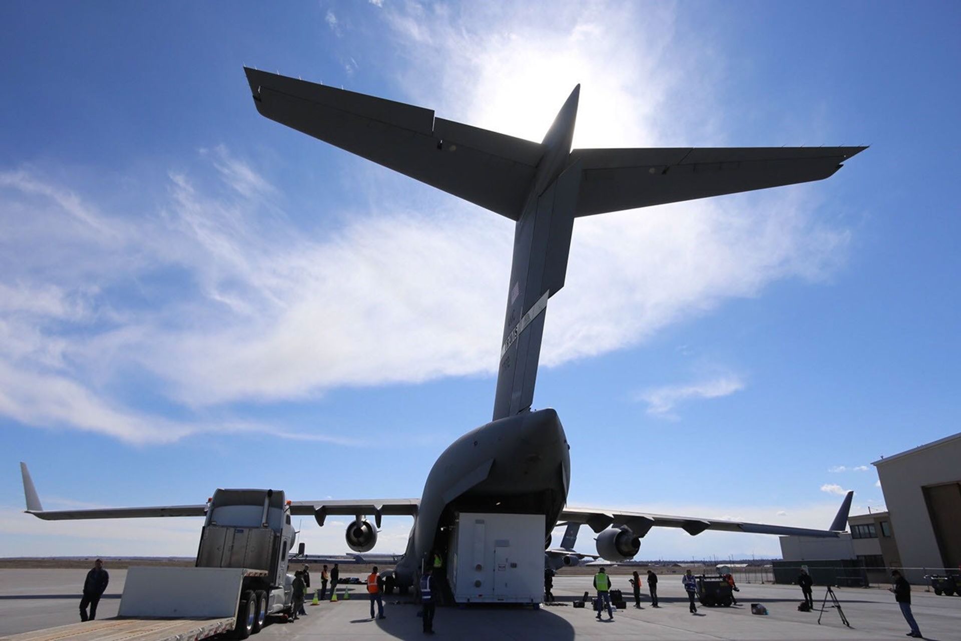 Personnel supporting NASA's InSight mission to Mars load the crated InSight spacecraft into a C-17 cargo aircraft at Buckley Air Force Base, Denver, for shipment to Vandenberg Air Force Base, California.