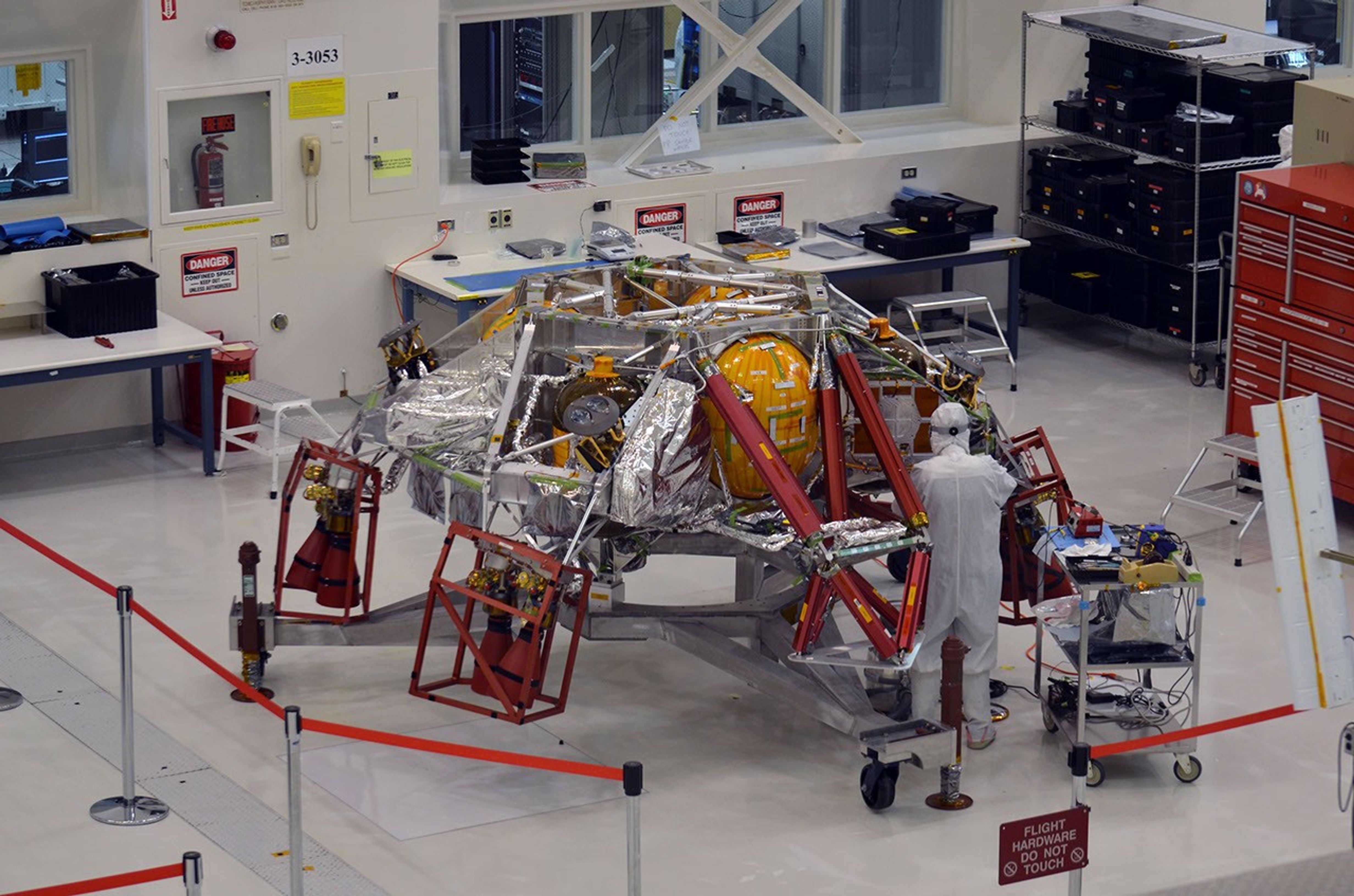 A technician works on the descent stage for NASA's Mars 2020 mission inside JPL's Spacecraft Assembly Facility. Mars 2020 is slated to carry NASA's next Mars rover to the Red Planet in July of 2020.