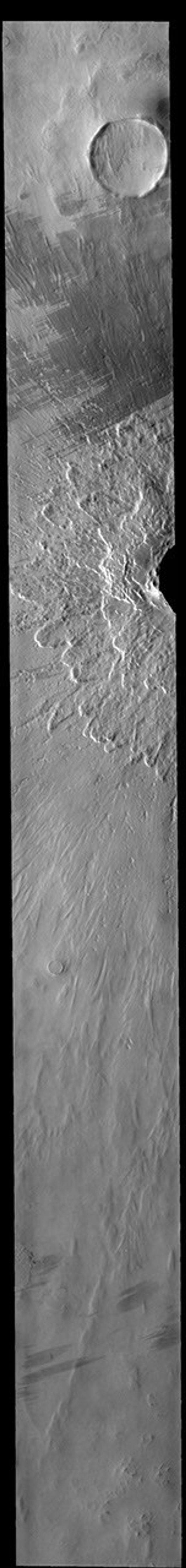 This image captured by NASA's 2001 Mars Odyssey spacecraft shows the part of the crater rim and ejecta surrounding Lonar Crater in the northern plains of Vastitas Borealis.