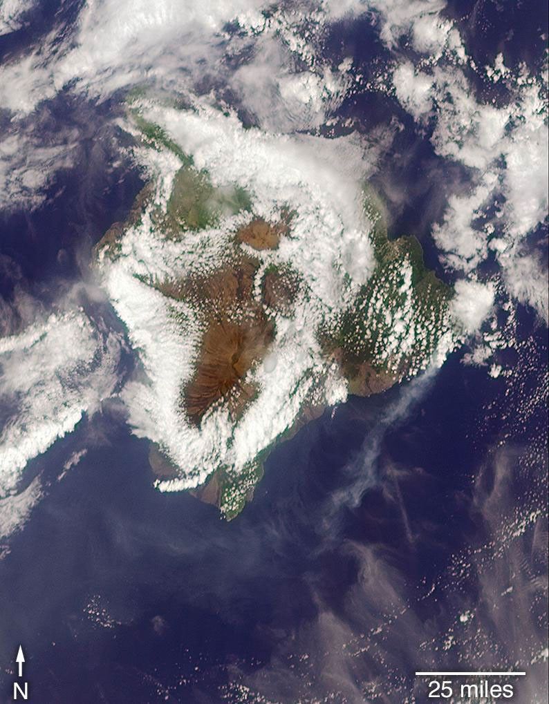 On May 6, 2018, NASA's Terra satellite captured this view the eruption of the Kilauea volcano as it passed overhead. Much of Hawaii was shrouded by clouds, including the fissure on its eastern point. A plume is visible streaming southwest over the ocean.