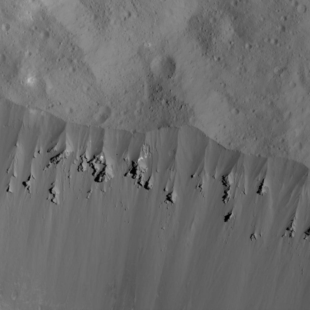 This image of landslides along Ceres' Occator Crater's eastern rim was obtained by NASA's Dawn spacecraft on June 9, 2018 from an altitude of about 27 miles (44 kilometers).