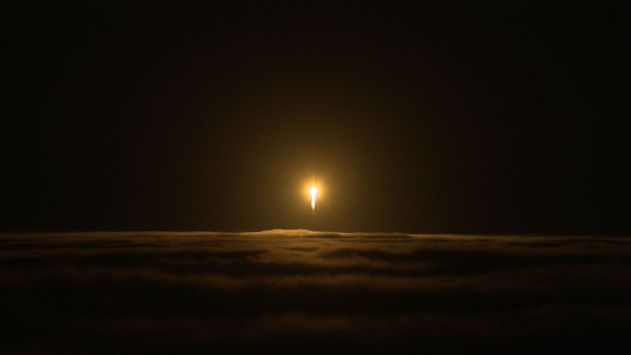 An Atlas V rocket carrying NASA's InSight lander breaks through cloud cover over Vandenberg Air Force Base on May 5, 2018.