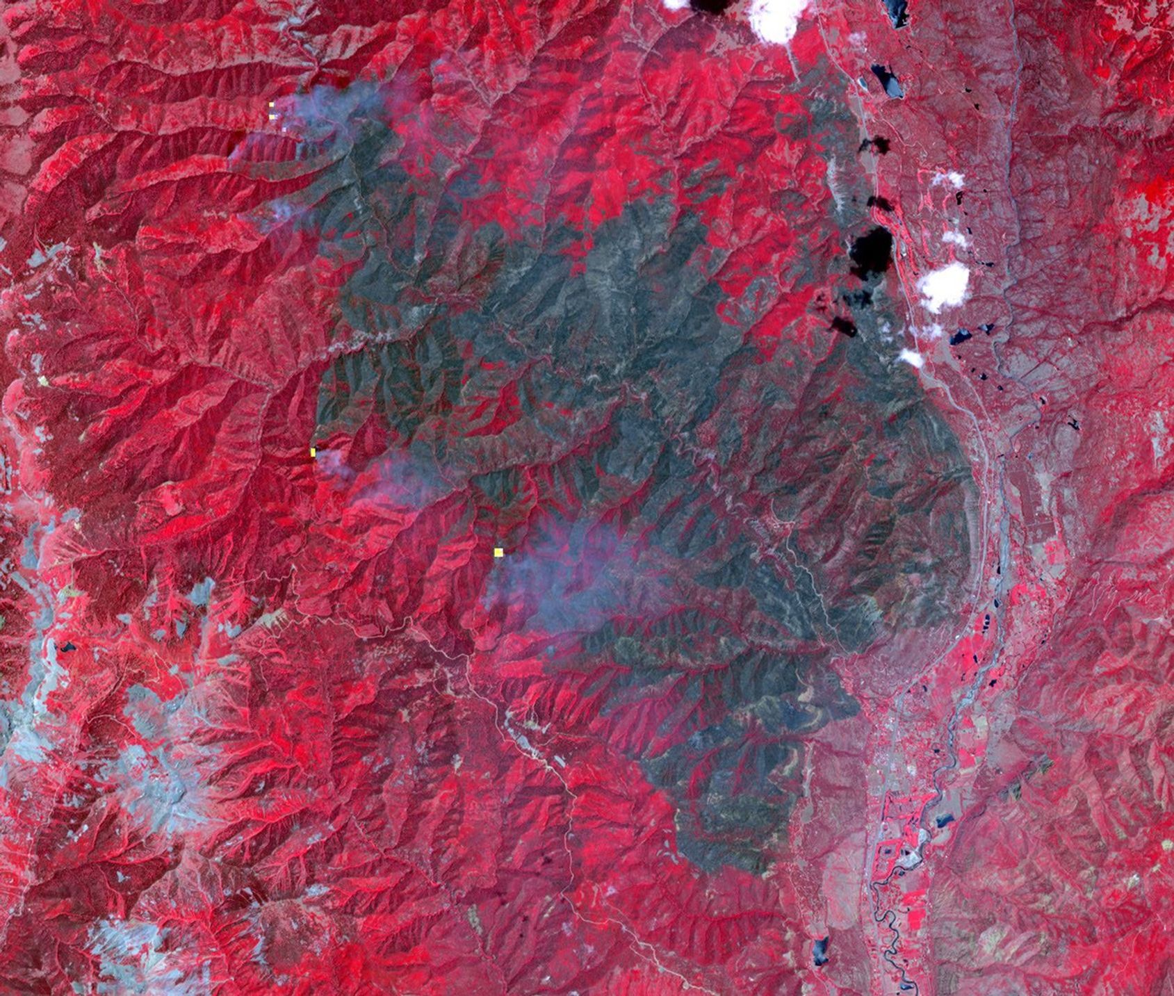 On June 26, 2018, NASA's Terra spacecraft acquired this image of 416 Fire which started June 1, 2018, about 13 miles north of Durango, Colorado. Vegetation in shown red, clouds in white, cities and bare rocky areas in gray, and burned area in dark gray.