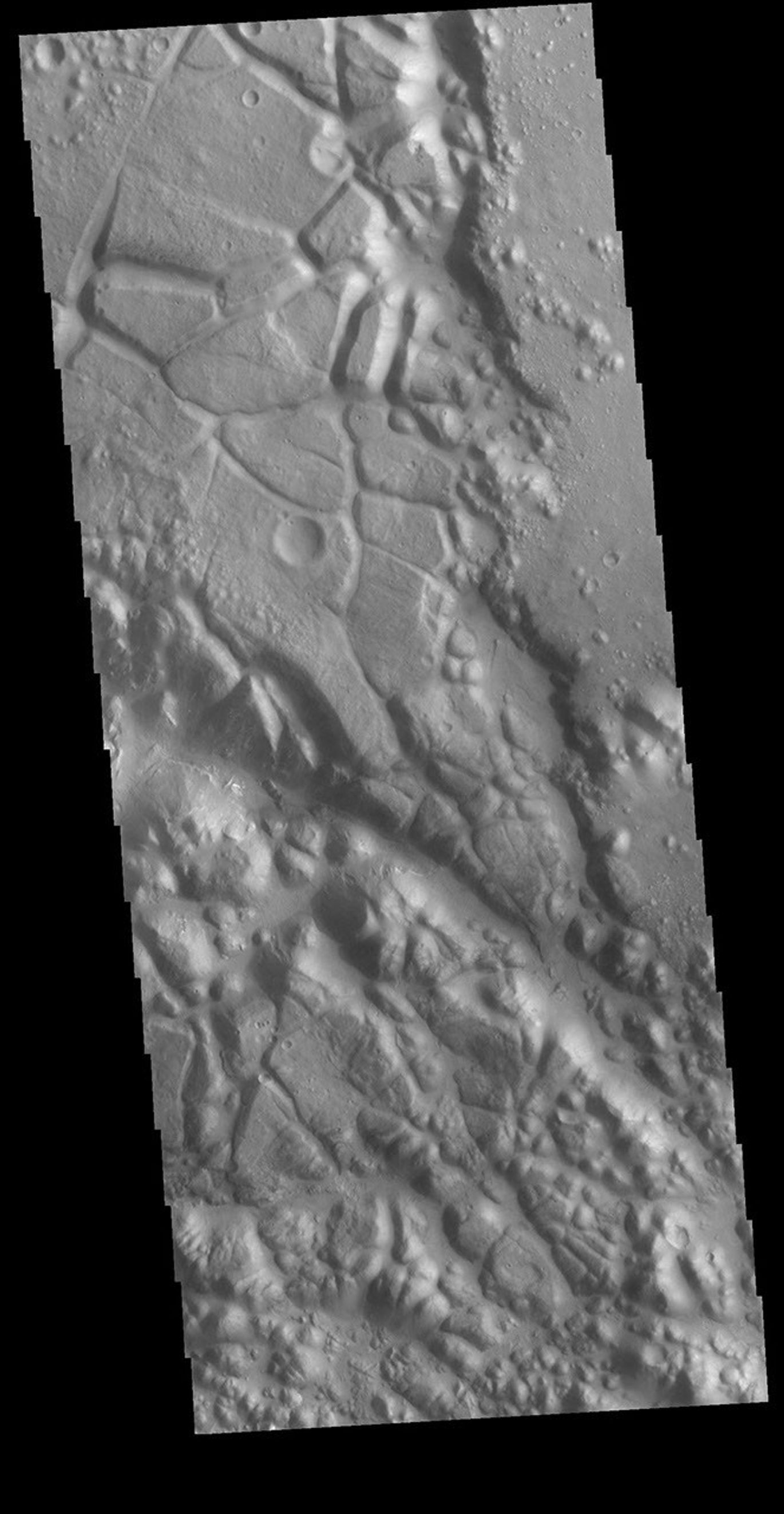 This image from NASA's Mars Odyssey shows shows part of Aram Chaos. Aram Chaos was initially formed by a large impact. Over time the crater interior was modified by several different processes, including liquid water.