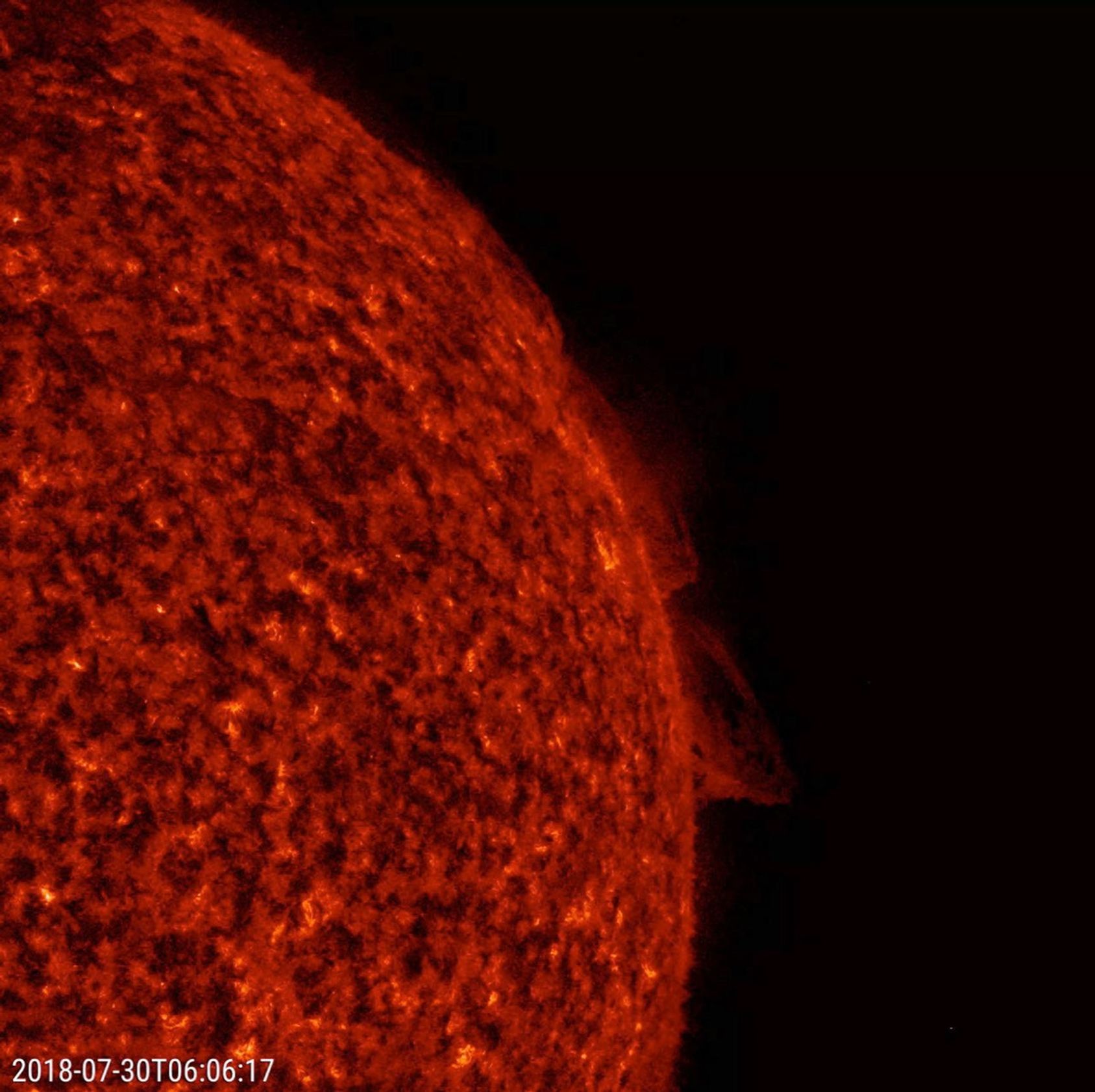 NASA's Solar Dynamics Observatory observes two relatively small prominences above the Sun's surface twisted and streamed charged particles over a 20-hour period July 30-31, 2018.