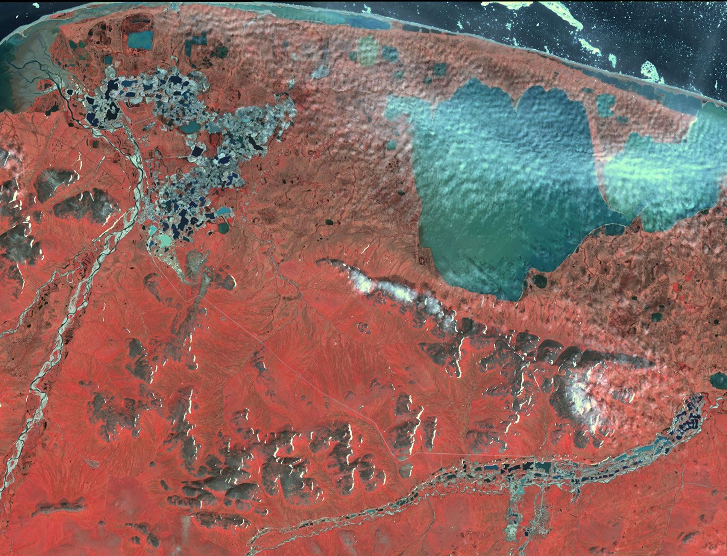 NASA's Terra spacecraft shows significant evidence of mining in northestern Siberia, along the Chukchi Sea, and 100 kilometers west of Mys Shmidta.