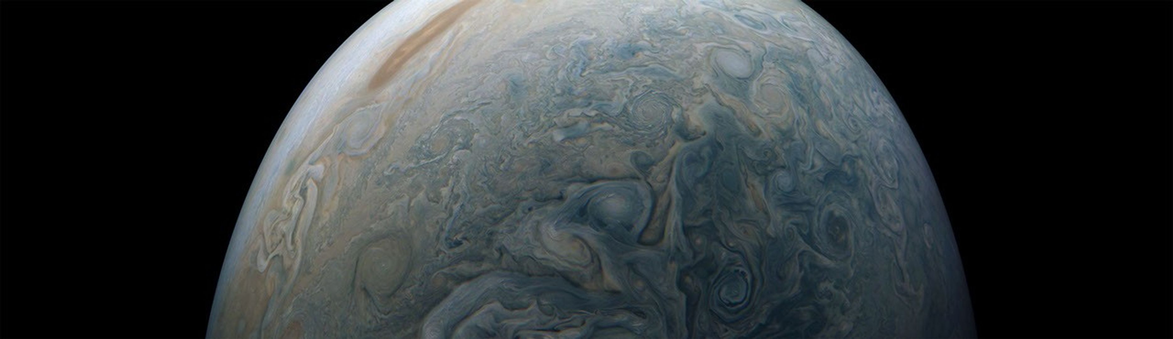 Clouds in a Jovian jet stream, called Jet N5, swirl in the center of this color-enhanced image from NASA's Juno spacecraft.