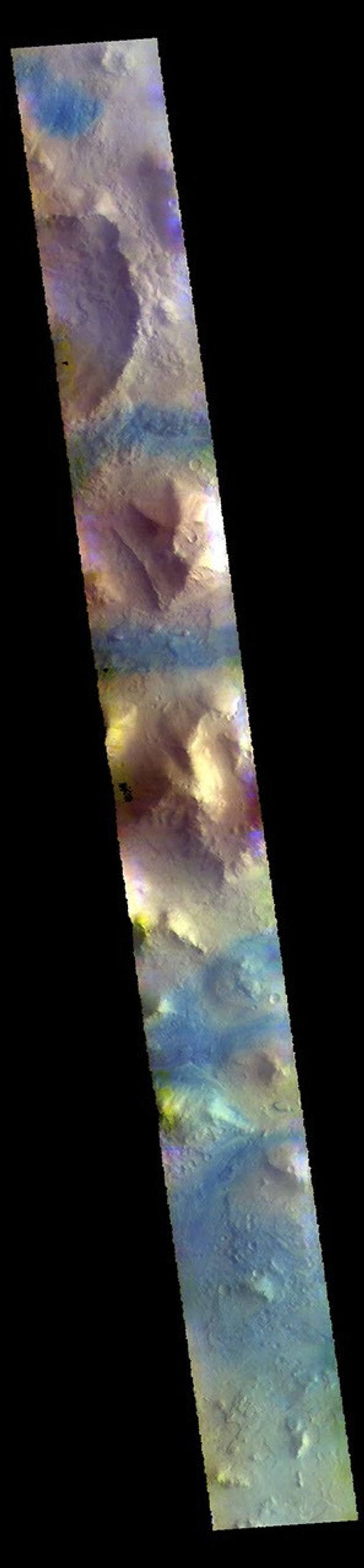This image from NASA's Mars Odyssey shows part of Terra Sabaea, including plains, craters, and mesas. The dark blue tones often indicate locations of basaltic sands.