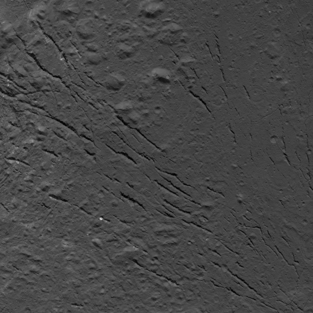 This image of a fracture pattern on the floor of Occator Crater on Ceres was obtained by NASA's Dawn spacecraft on July 25, 2018 from an altitude of about 87 miles (140 kilometers).