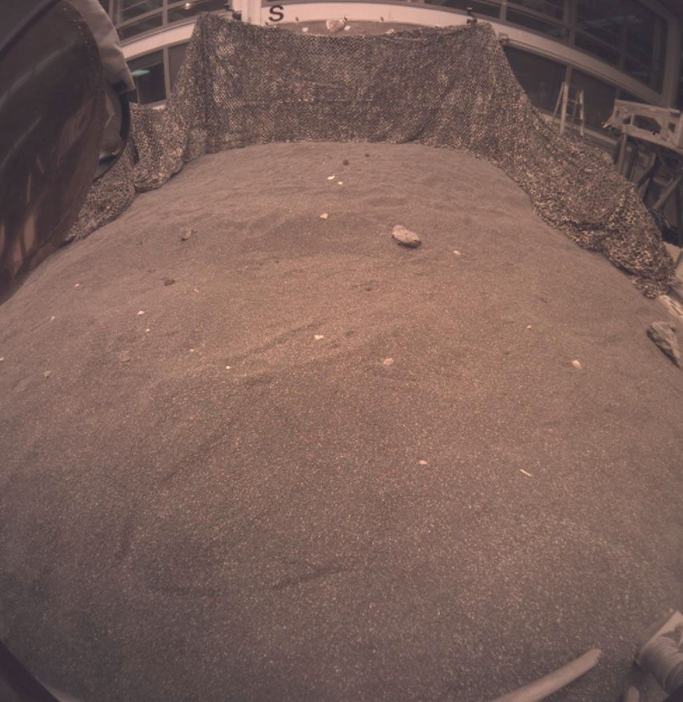 This image shows an engineering model of NASA's InSight lander during a rehearsal for instrument deployment in a Mars-like testbed at NASA's Jet Propulsion Laboratory, Pasadena, California.
