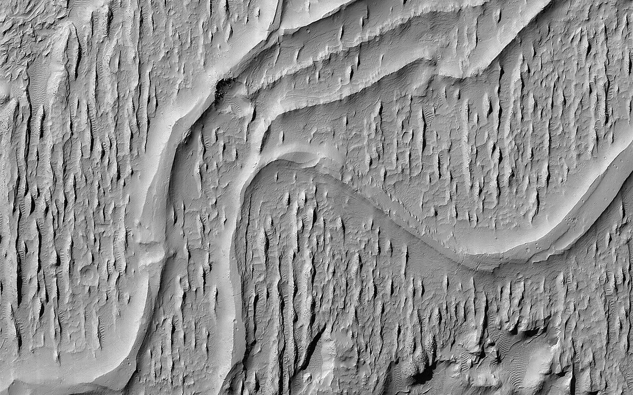 This image acquired on August 27, 2023 by NASA's Mars Reconnaissance Orbiter shows ridges in Aeolis Planum which tell a story of ancient rivers and a Mars very different to that of today.