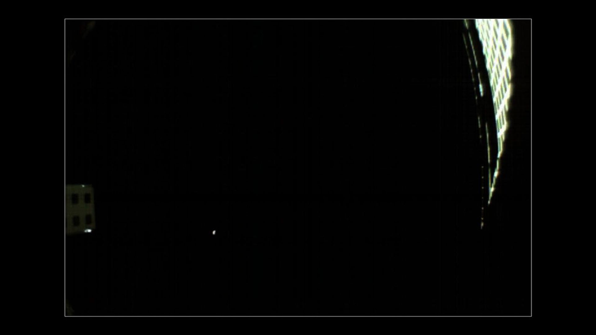 On Nov. 24, 2018, MarCO-B, one of NASA's Mars Cube One (MarCO) CubeSats, took this picture of the Red Planet, which appears as small, grey dot in the lower left quadrant of the image.
