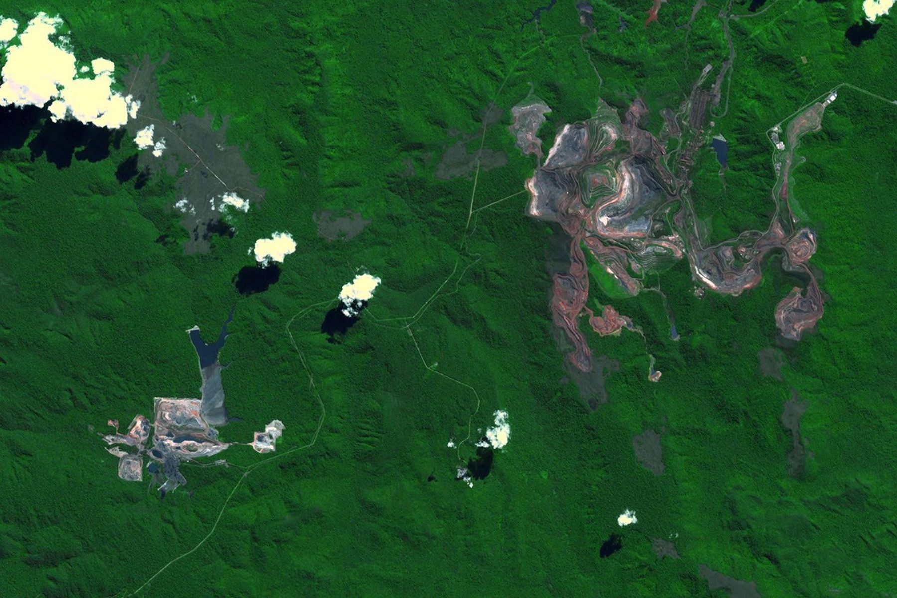 NASA's Terra spacecraft shows the Carajas Mine, the largest open-pit iron ore mine in the world. It is located in the state of Para, northern Brazil.