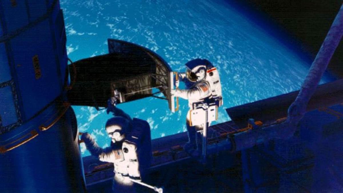 This image of NASA's Hubble Space Telescope shows Astronaut Jeffrey Hoffman and Story Musgrave installing the Wide Field and Planetary Camera 2 (WFPC2) on the Hubble Space Telescope, during SM1 in December, 1993.