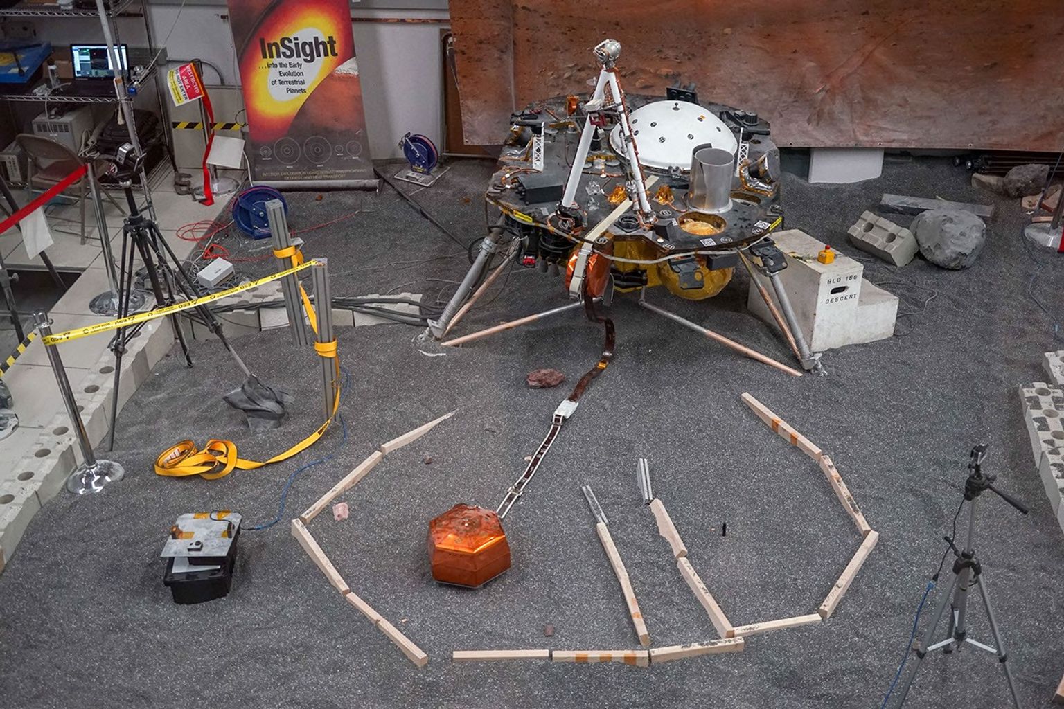 ForeSight, a fully functional, full-size model of NASA's InSight lander, sits in a lab space that has been sculpted to match terrain in front of the real lander on Mars. This work was done at NASA's Jet Propulsion Laboratory in Pasadena, California.