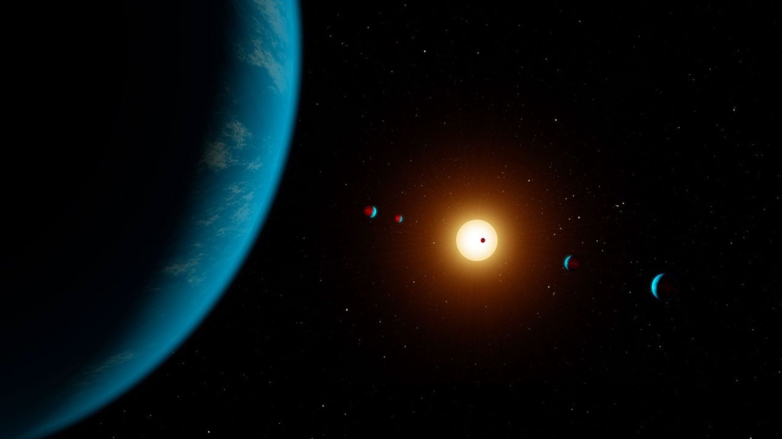 This artist's illustration shows the planetary system K2-138. Five planets were initially detected in the system but in 2018 scientists found evidence of a sixth planet.
