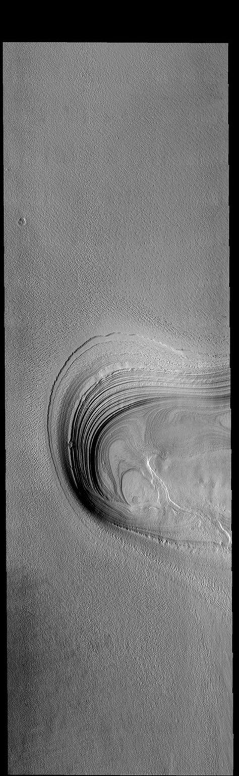 This image from NASA's Mars Odyssey shows a location along the margin of Ultima Lingula, where the polar cap meets the surrounding plains.