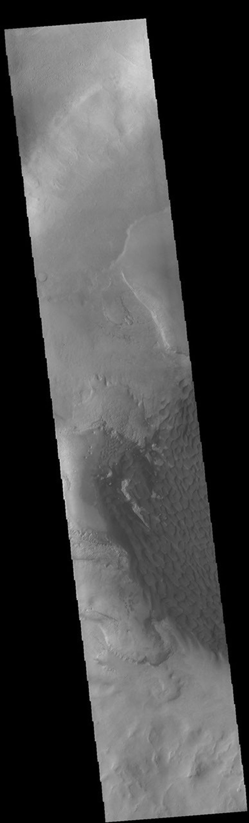 This image from NASA's Mars Odyssey shows part of the dune field on the floor and within the pits of Rabe Crater.