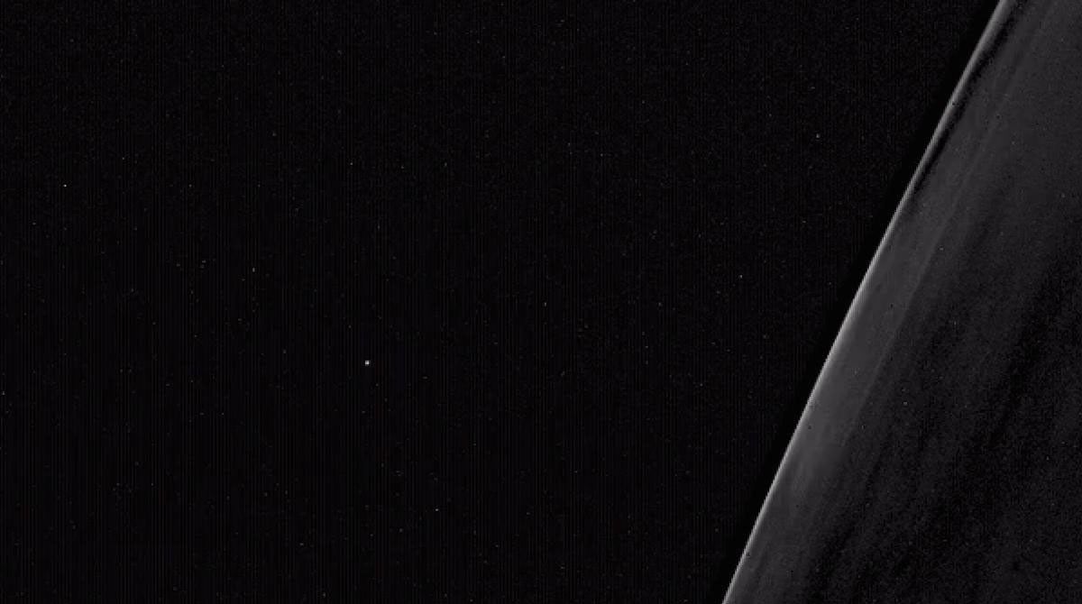 A brief laser flash, seen here at the center of the image, was part of an experiment conducted by two NASA CubeSats.