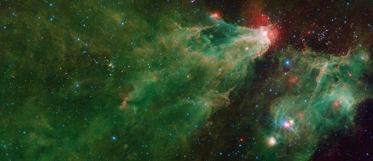 A mosaic by NASA's Spitzer Space Telescope of the Cepheus C and Cepheus B regions. This image combines data from Spitzer's IRAC and MIPS instruments.
