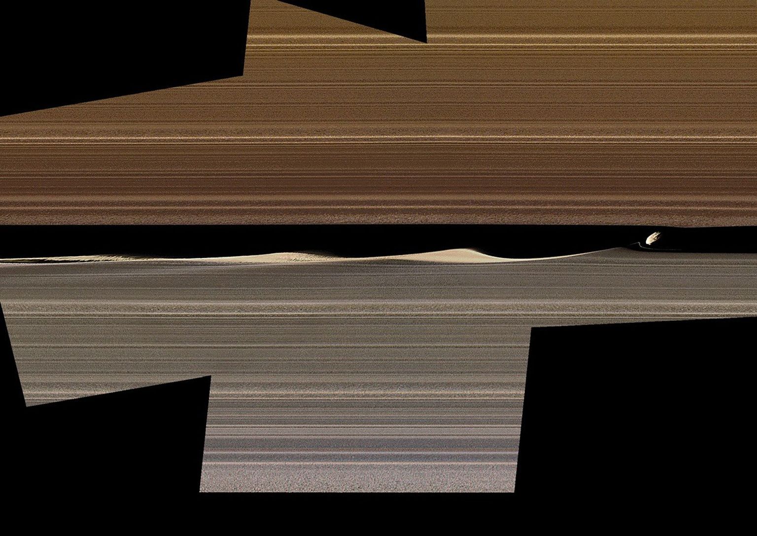 NASA's Cassini spacecraft shows this enhanced-color image mosaic of Daphnis, one of the moons embedded in Saturn's rings.