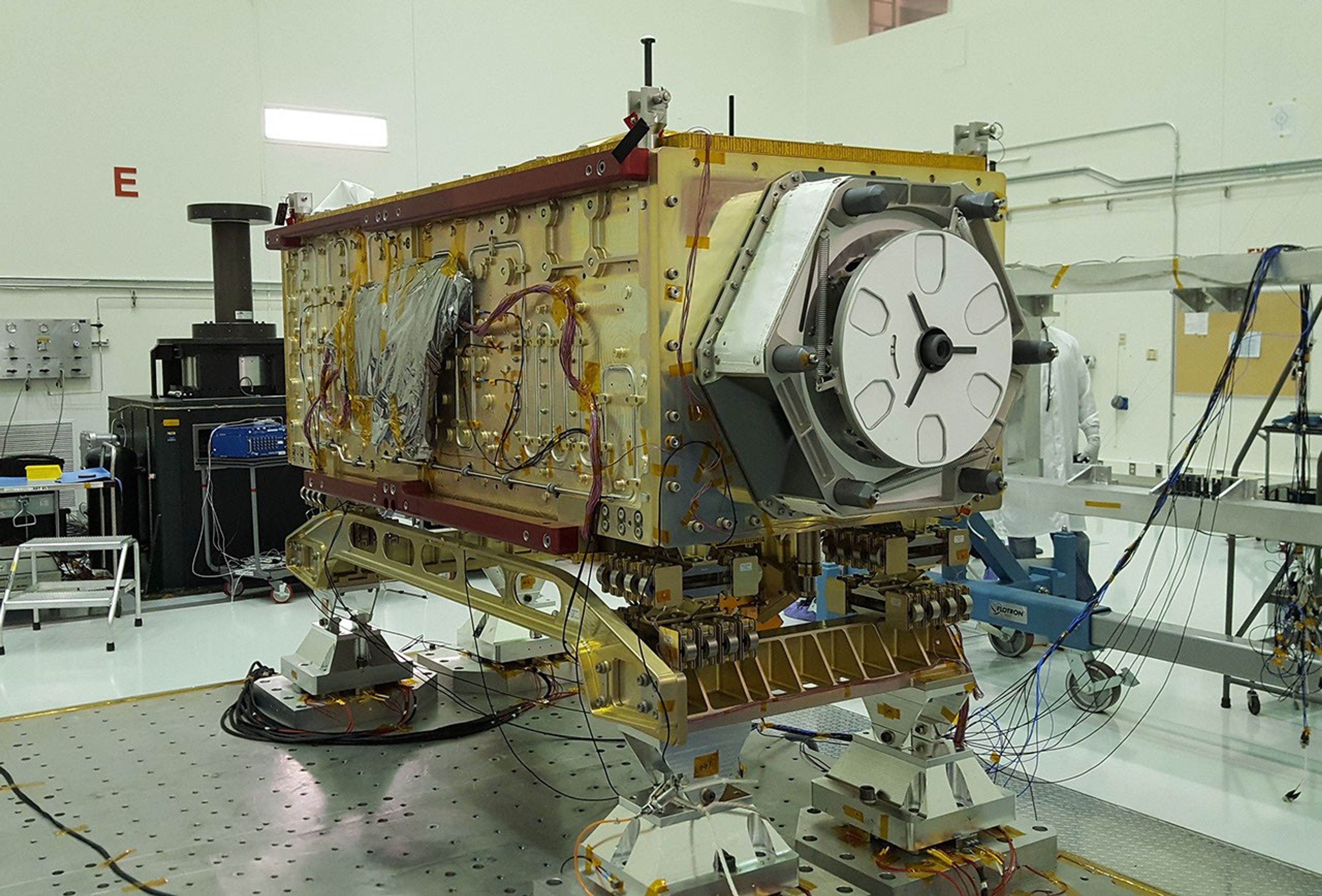 OCO-3 sits on the large vibration table (known as the 'shaker') in the Environmental Test Lab at the Jet Propulsion Laboratory.