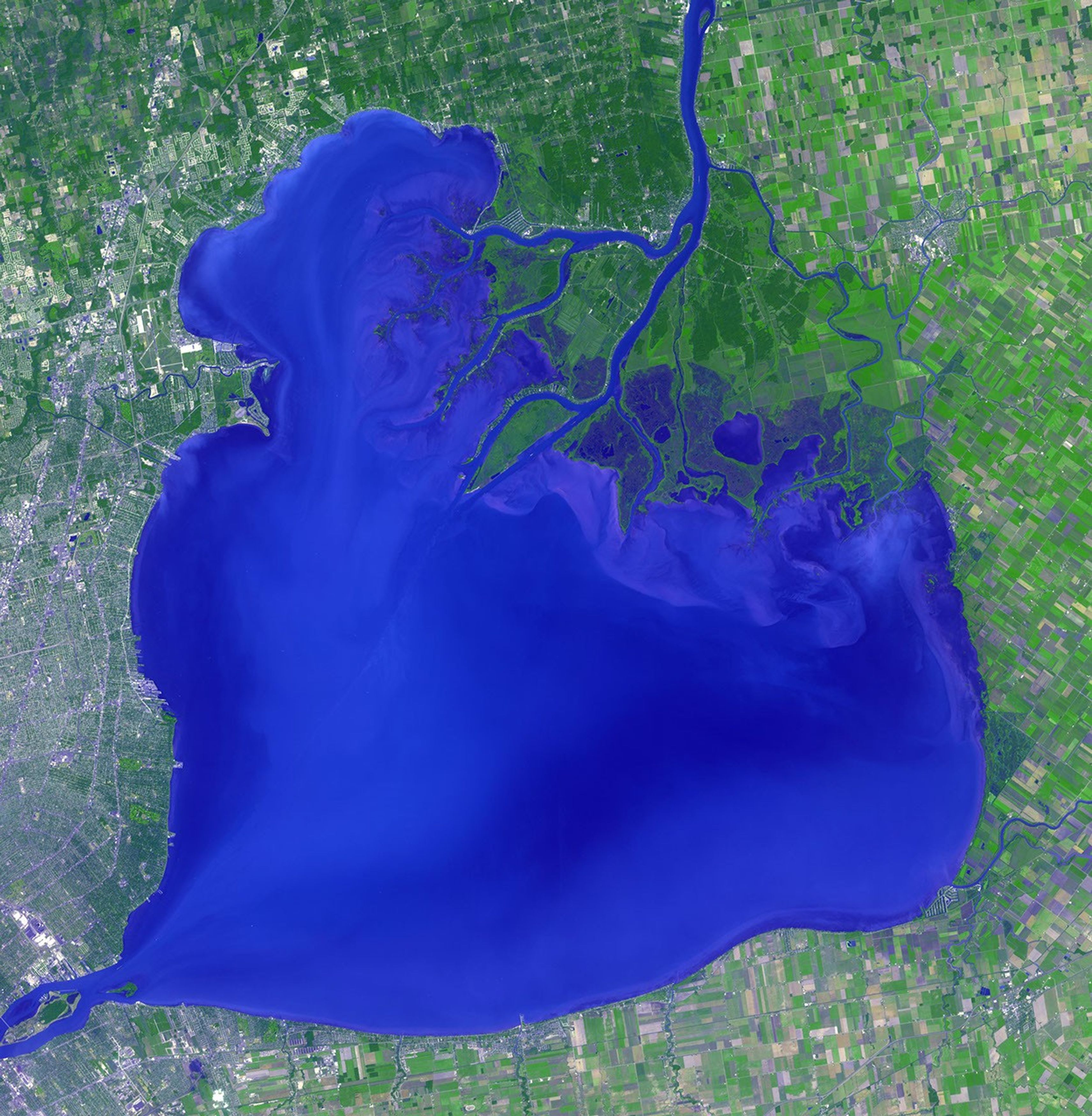 NASA's Terra spacecraft shows Lake St. Clair connects Lake Huron, via the St. Clair River, to Lake Erie, via the Detroit River.