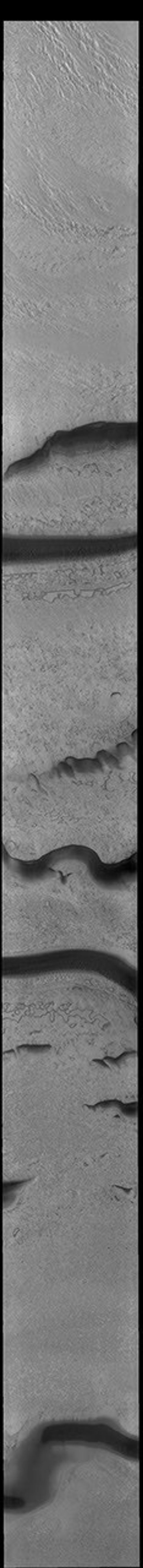 This image from NASA's Mars Odyssey shows part of the surface of the south polar cap. Collected at the end of southern summer, most of the ice is frost free and different textures are readily apparent.
