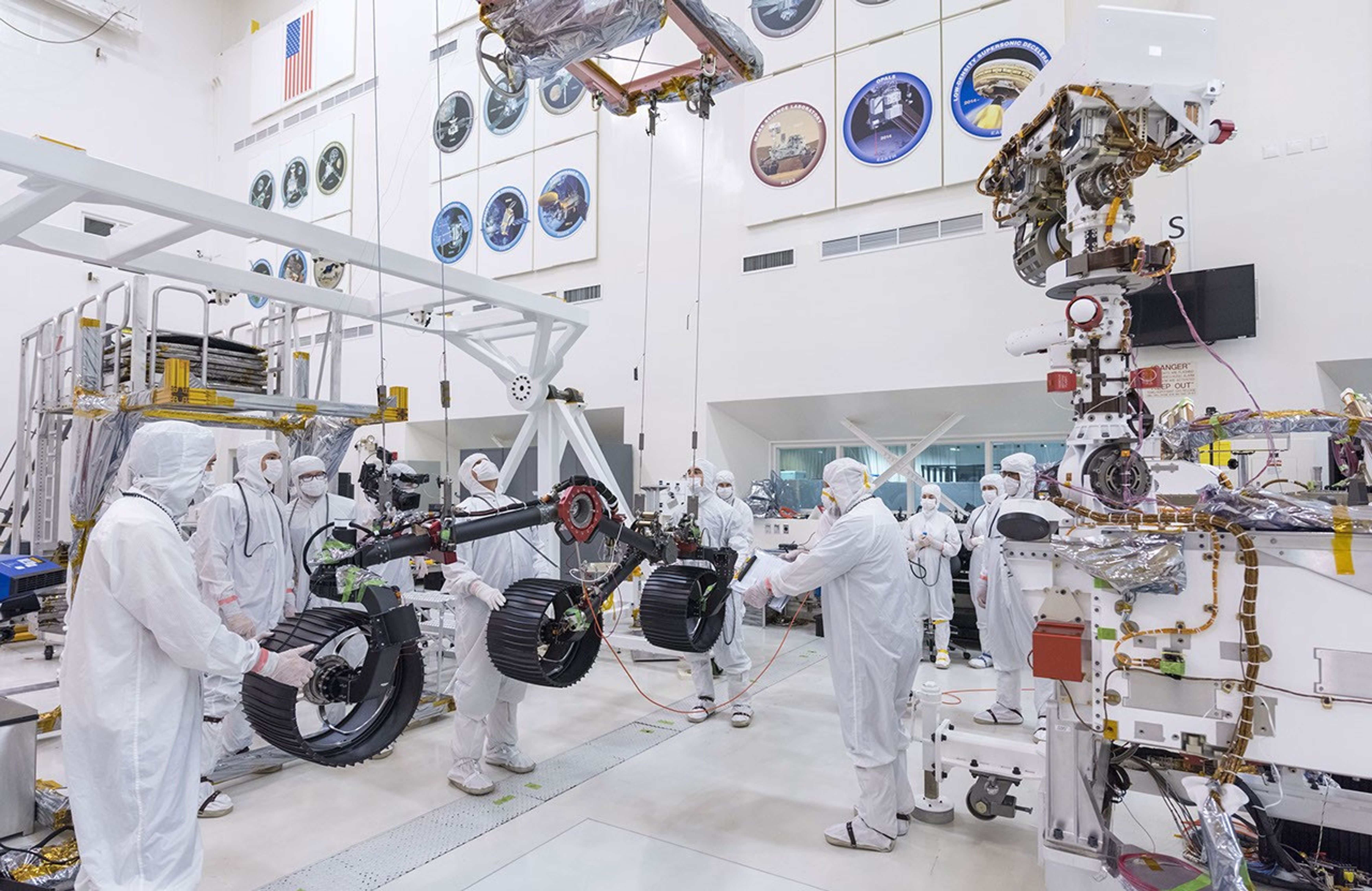 In this image, taken on June 13, 2019, engineers prepare the starboard legs and wheels for integration onto NASA's Mars 2020 rover.