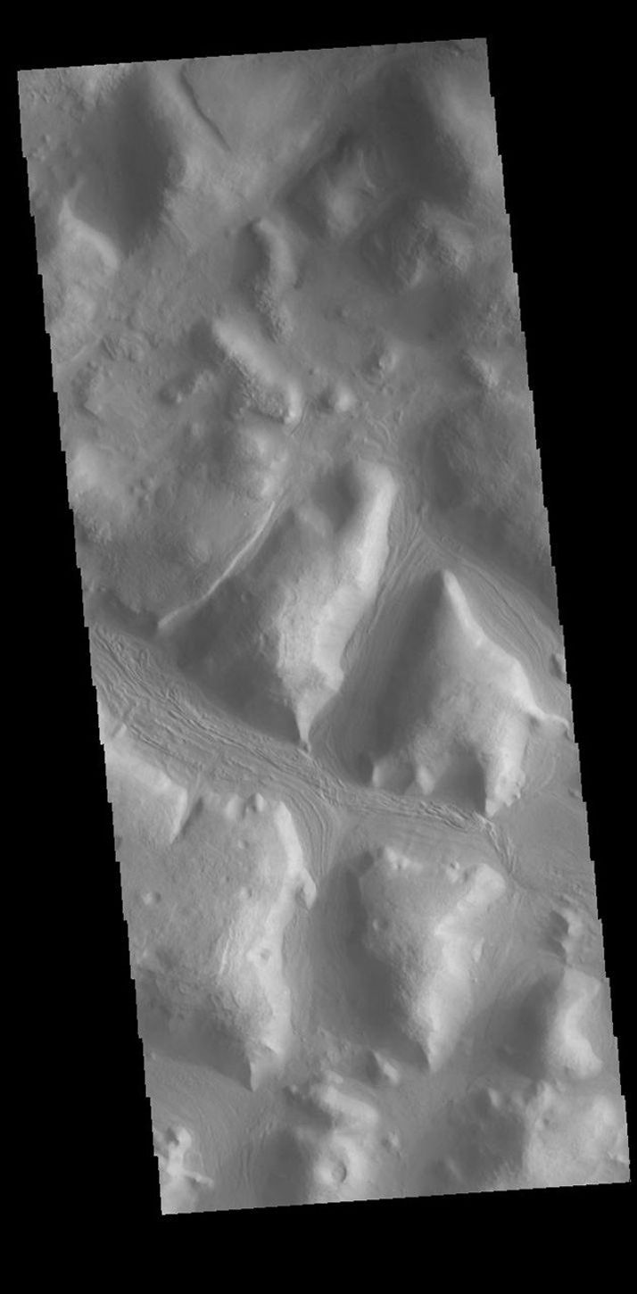 This image from NASA's Mars Odyssey shows the margin of the Terra Sabaea highlands and the Nilosyrtis Mensae lowlands.