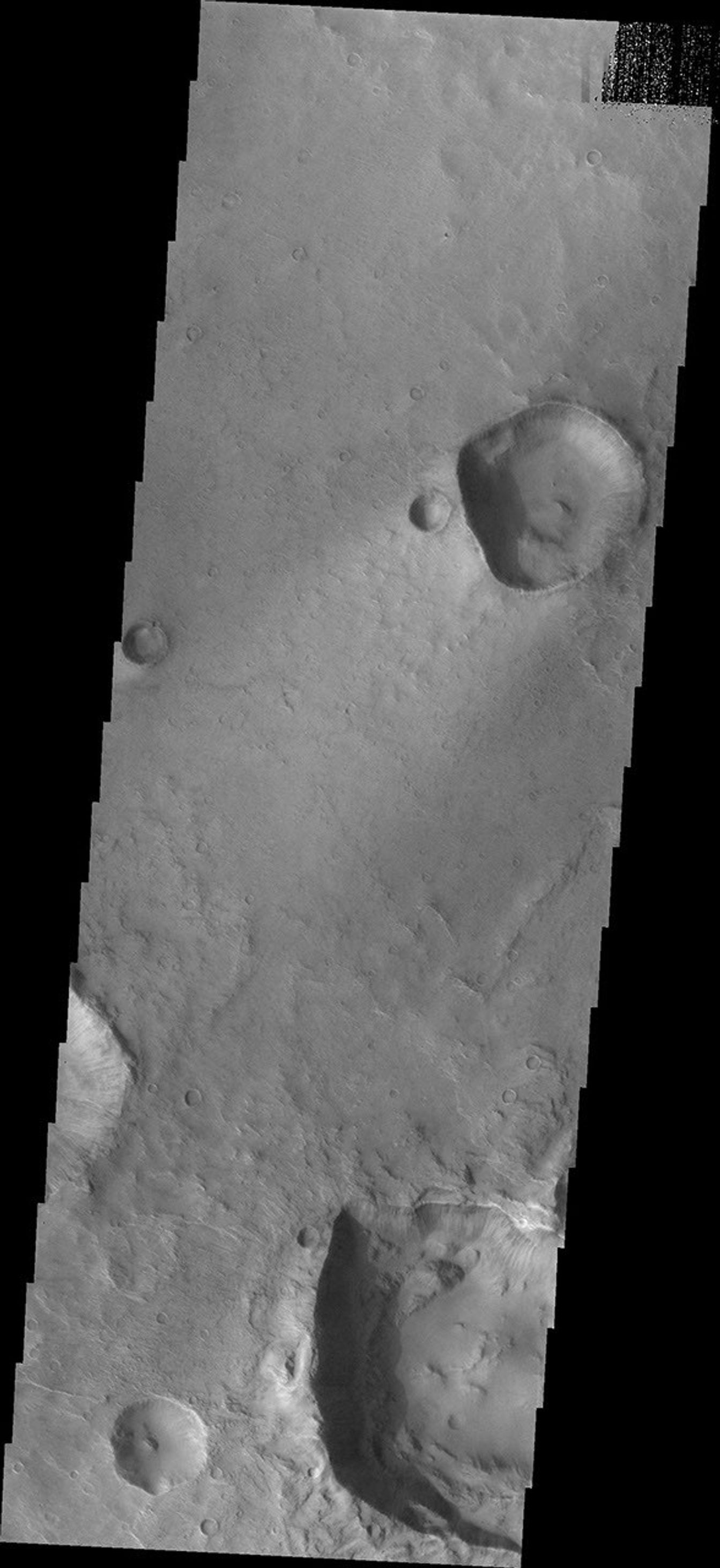 This image from NASA's Mars Odyssey shows two craters located on the margin of Syrtis Major Planum.
