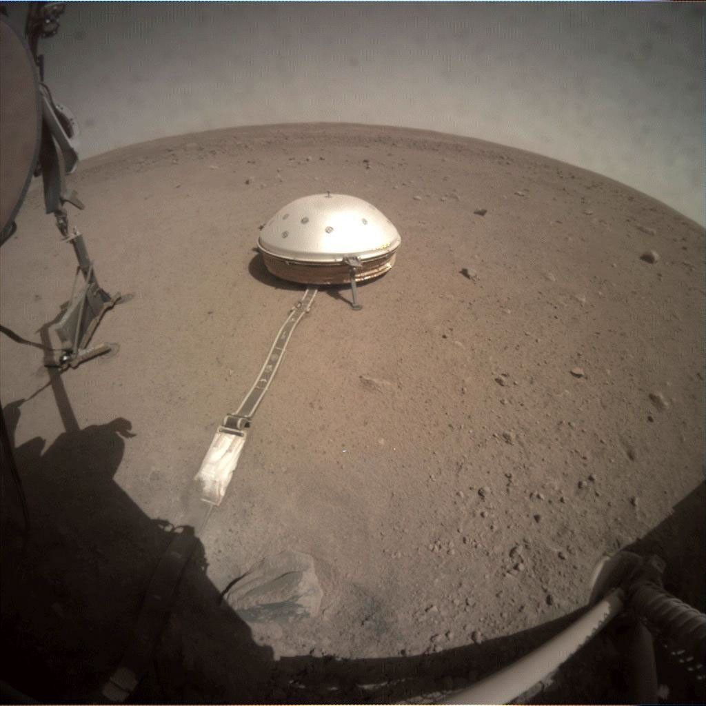 On June 28, 2019, NASA's InSight lander used its robotic arm to move the support structure for its digging instrument. This view was captured by the fisheye Instrument Context Camera.