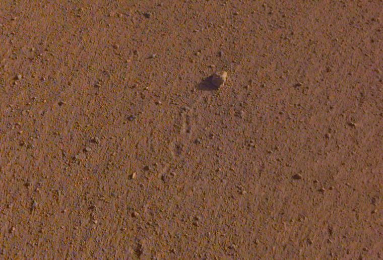 The rock in the center of this image was tossed about 3 feet (1 meter) by NASA's InSight spacecraft as it touched down on Mars on November 26, 2018.