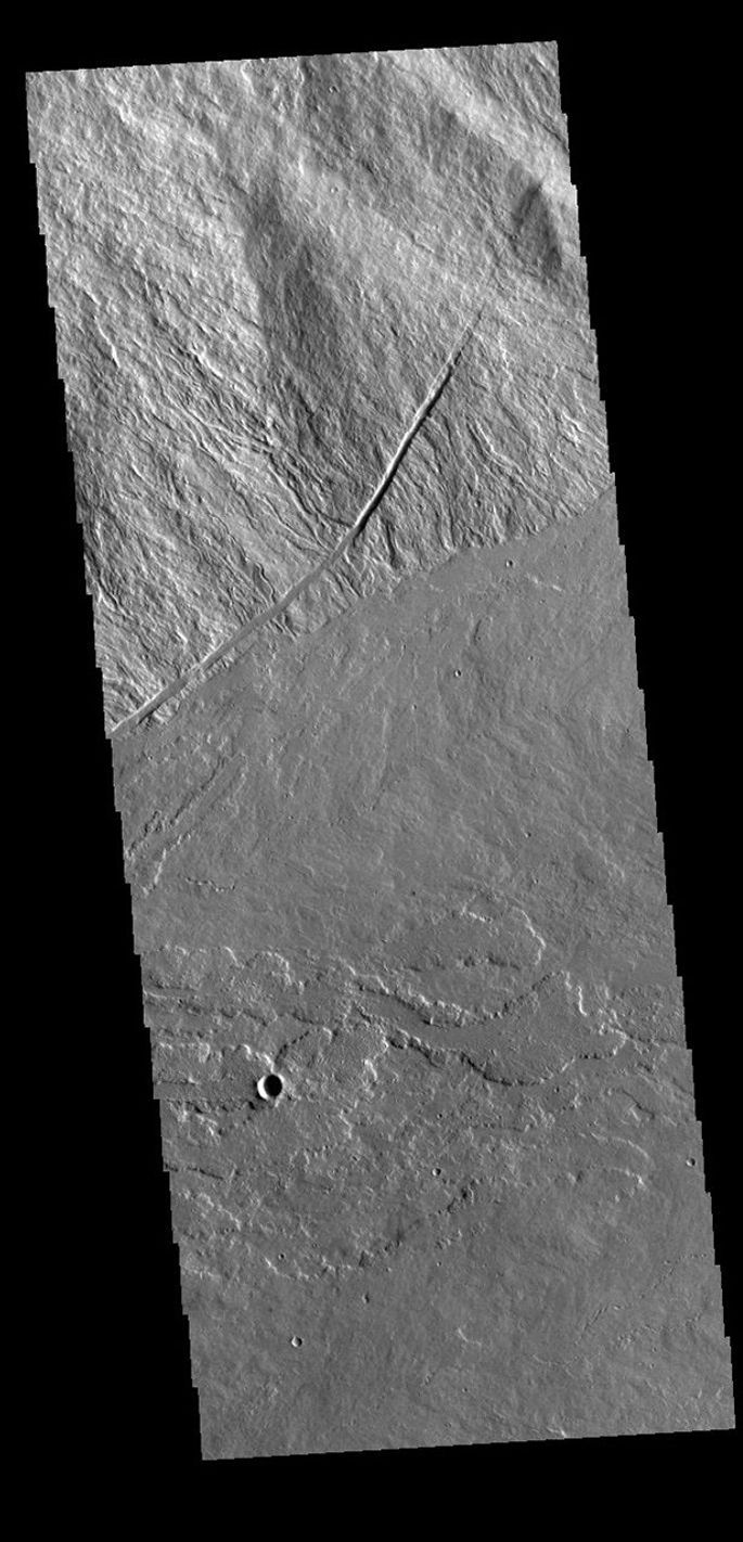 This image from NASA's Mars Odyssey shows where the southeastern flank of Ascraeus Mons meets the surrounding volcanic plains.