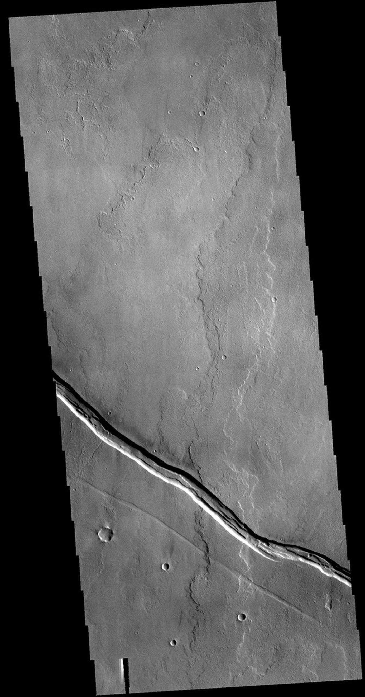 This image from NASA's Mars Odyssey shows part of the Tharsis lava plains between Sulci Gordii and Ulysses Fossae.