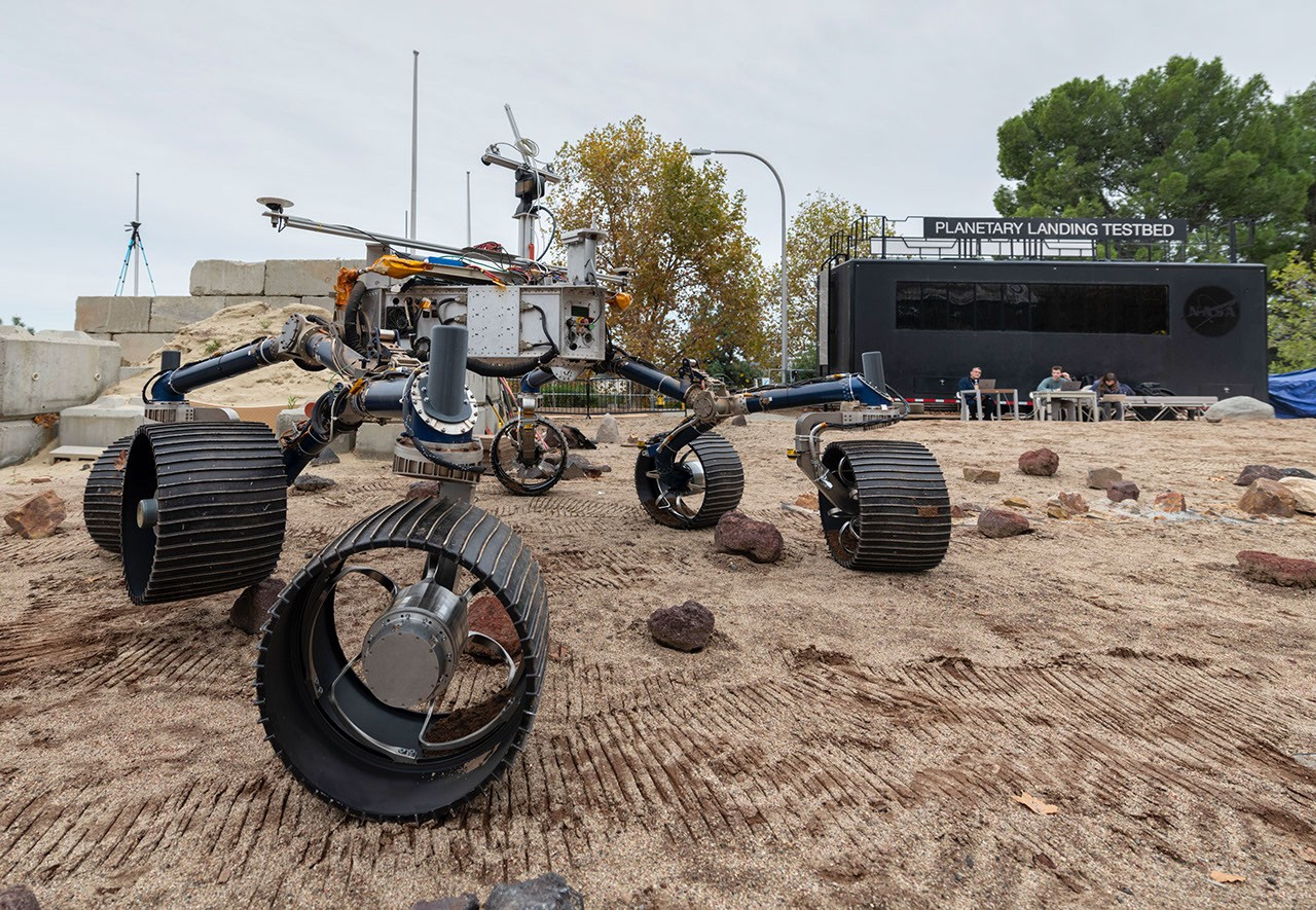 An engineering model of NASA's Mars 2020 rover makes tracks during a driving test in the Mars Yard, at NASA's Jet Propulsion Laboratory in Pasadena, California.