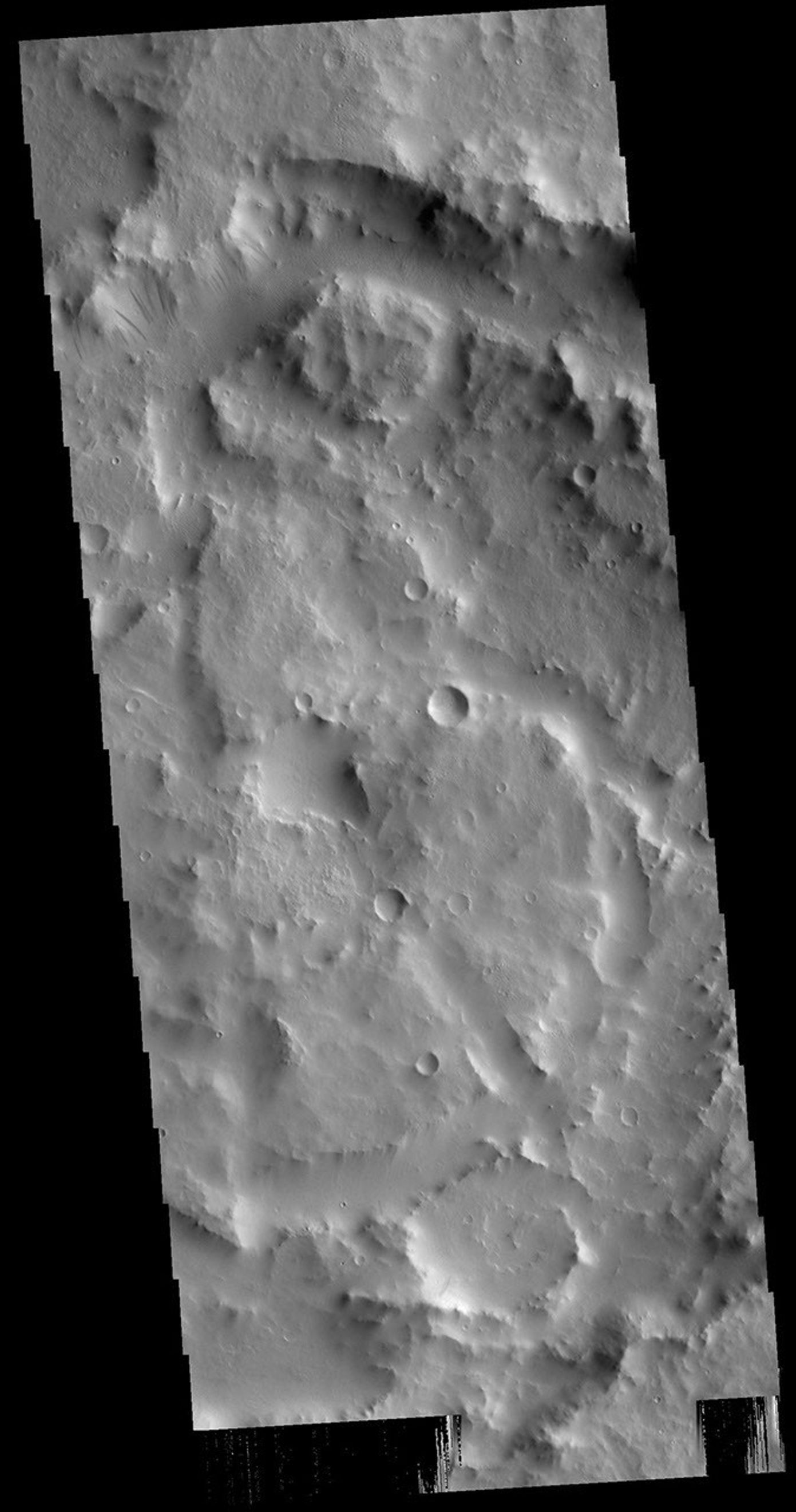 This image from NASA's Mars Odyssey shows the complex interior of an unnamed crater in Arabia Terra.