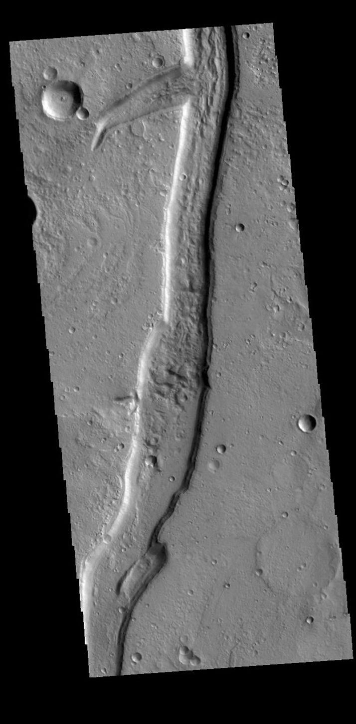 This image from NASA's Mars Odyssey shows a linear depression which is part of Idaeus Fossae.