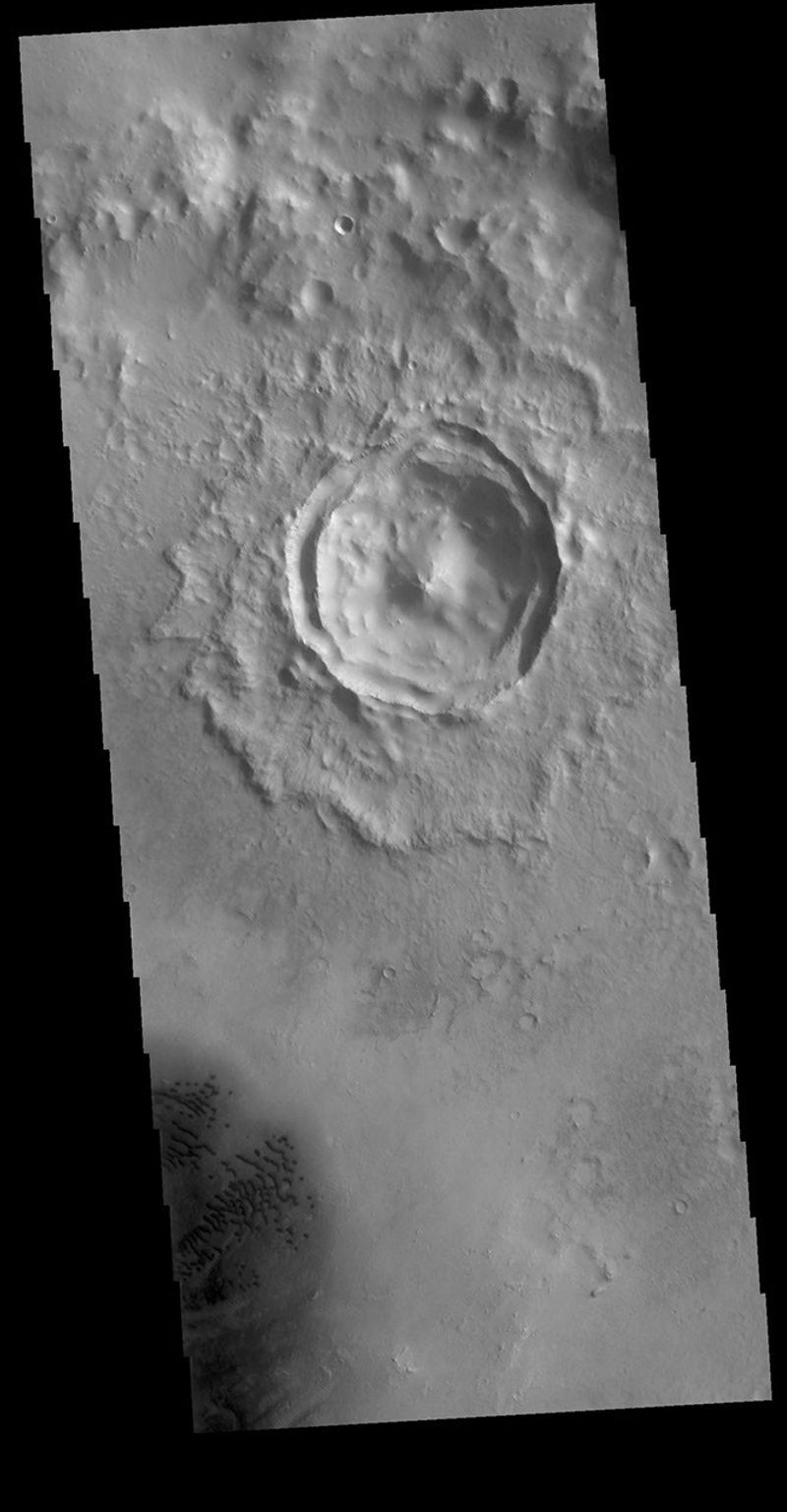 This image from NASA's Mars Odyssey shows an unnamed crater located in Arabia Terra. The small crater seen in the image is located on the floor of a much larger crater.