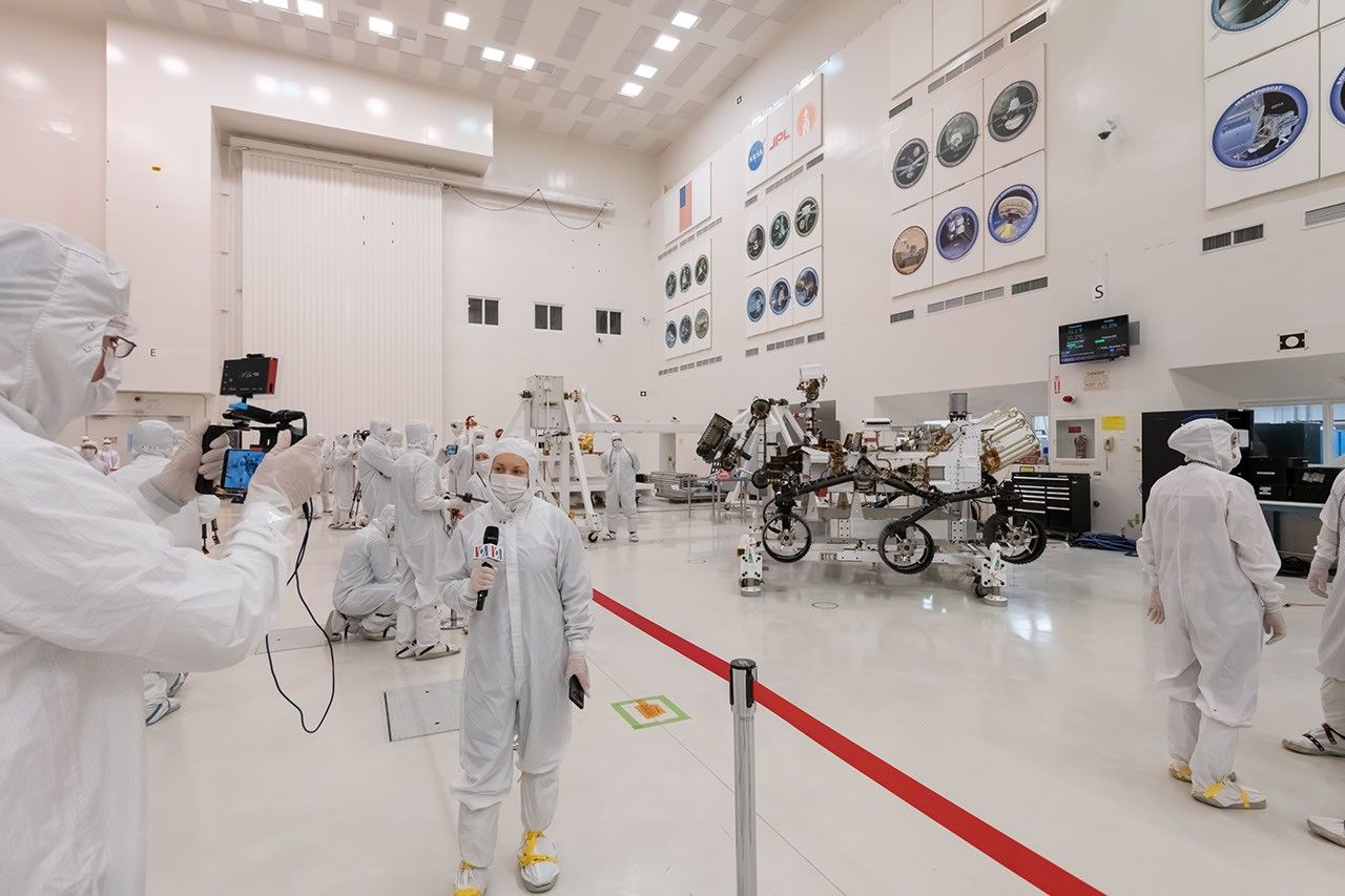 Members of the media interview the builders of the Mars 2020 mission. This image was taken inside the clean room on Dec. 27, 2019.