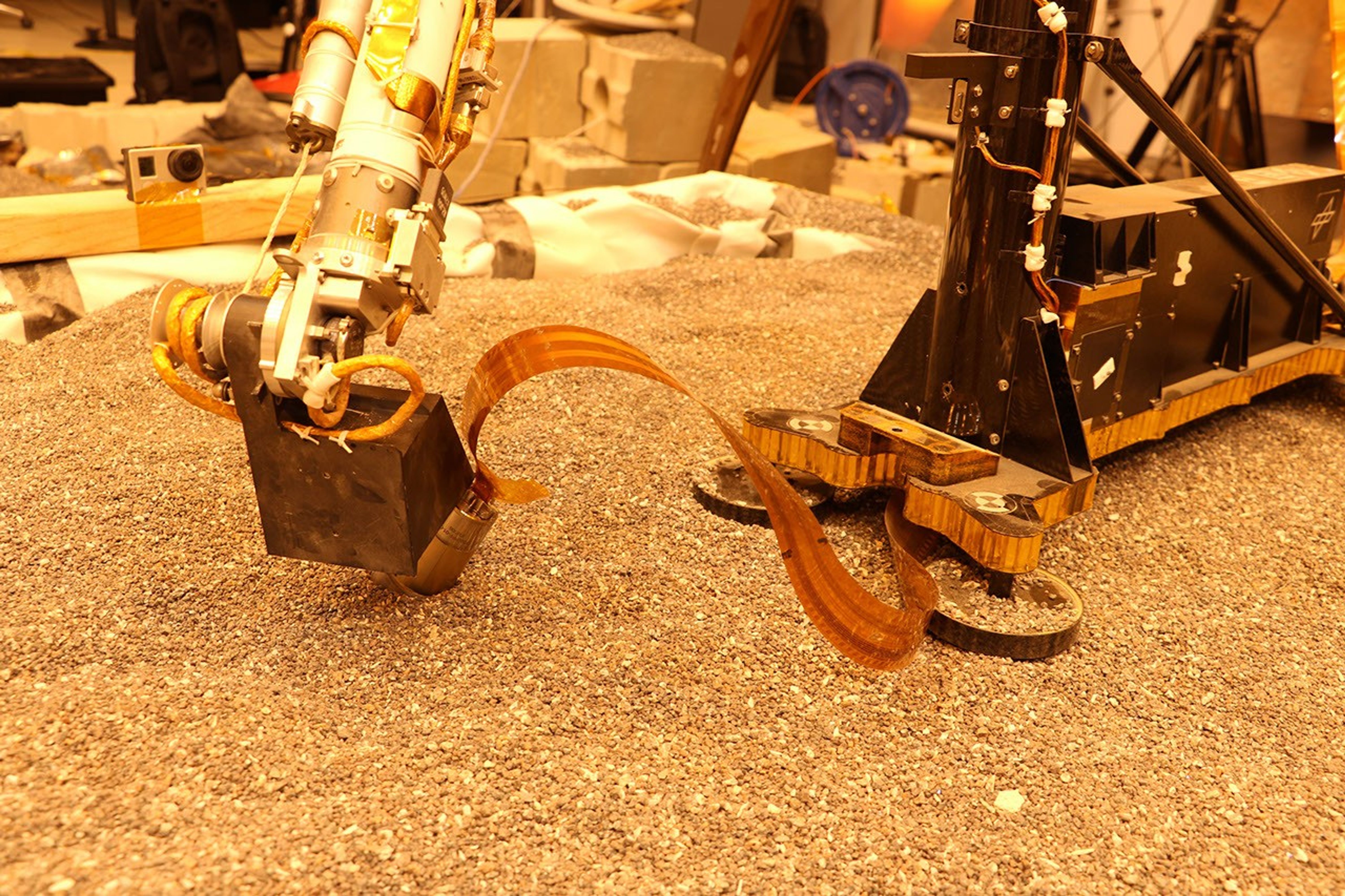 This test using an engineering model of the InSight lander here on Earth shows how the spacecraft on Mars will use its robotic arm to press on a digging device, called the mole.